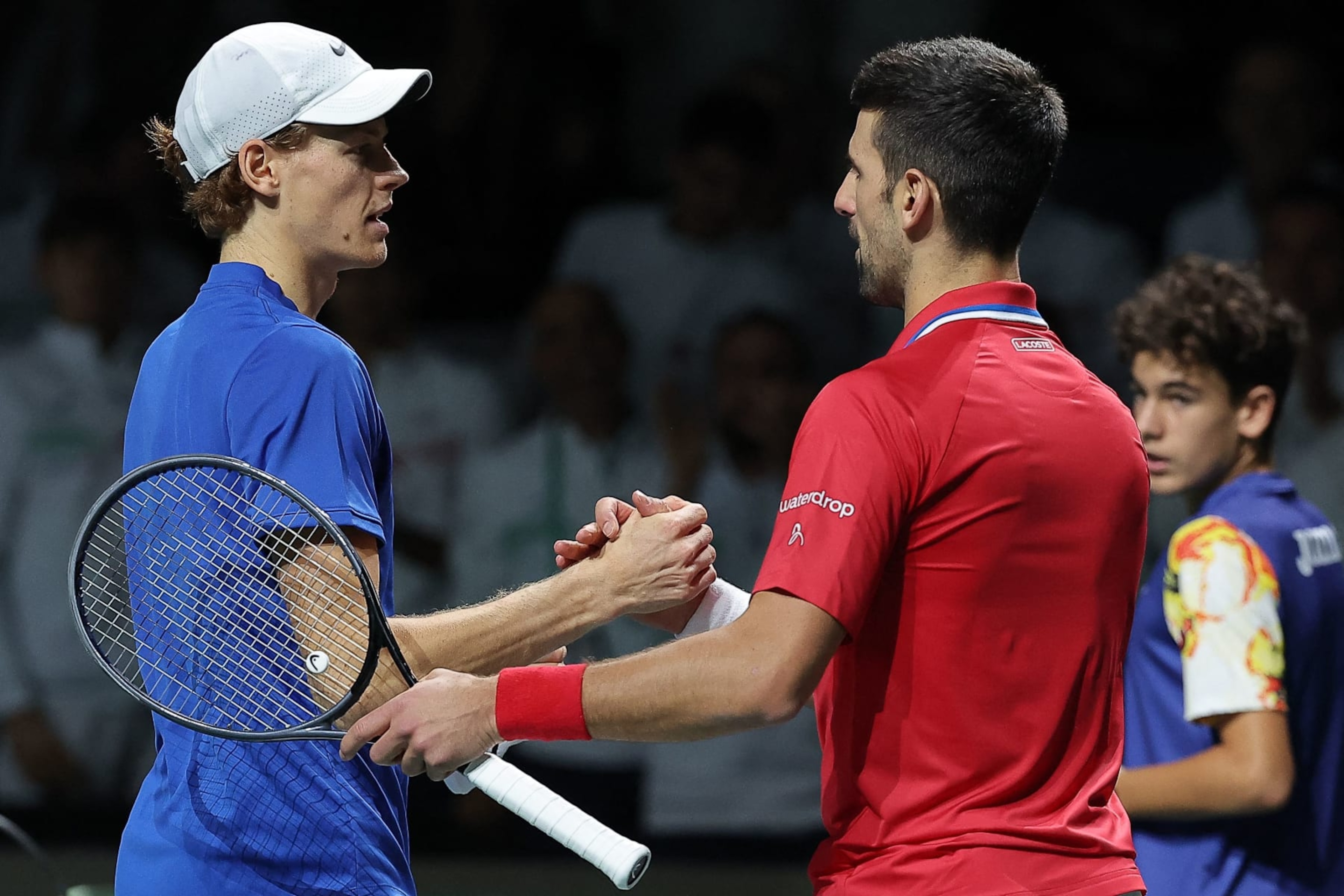 Italy's Jannik Sinner greets Serbia's Novak Djokovic after winning the second men's singles semifinal tennis match between Italy and Serbia of the Davis Cup tennis tournament at the Martin Carpena sportshall, in Malaga on November 25, 2023. (Photo by LLUIS GENE / AFP) (Photo by LLUIS GENE/AFP via Getty Images) Italy's Jannik Sinner greets Serbia's Novak Djokovic after winning the second men's singles semifinal tennis match between Italy and Serbia of the Davis Cup tennis tournament at the Martin Carpena sportshall, in Malaga on November 25, 2023. (Photo by LLUIS GENE / AFP) (Photo by LLUIS GENE/AFP via Getty Images)