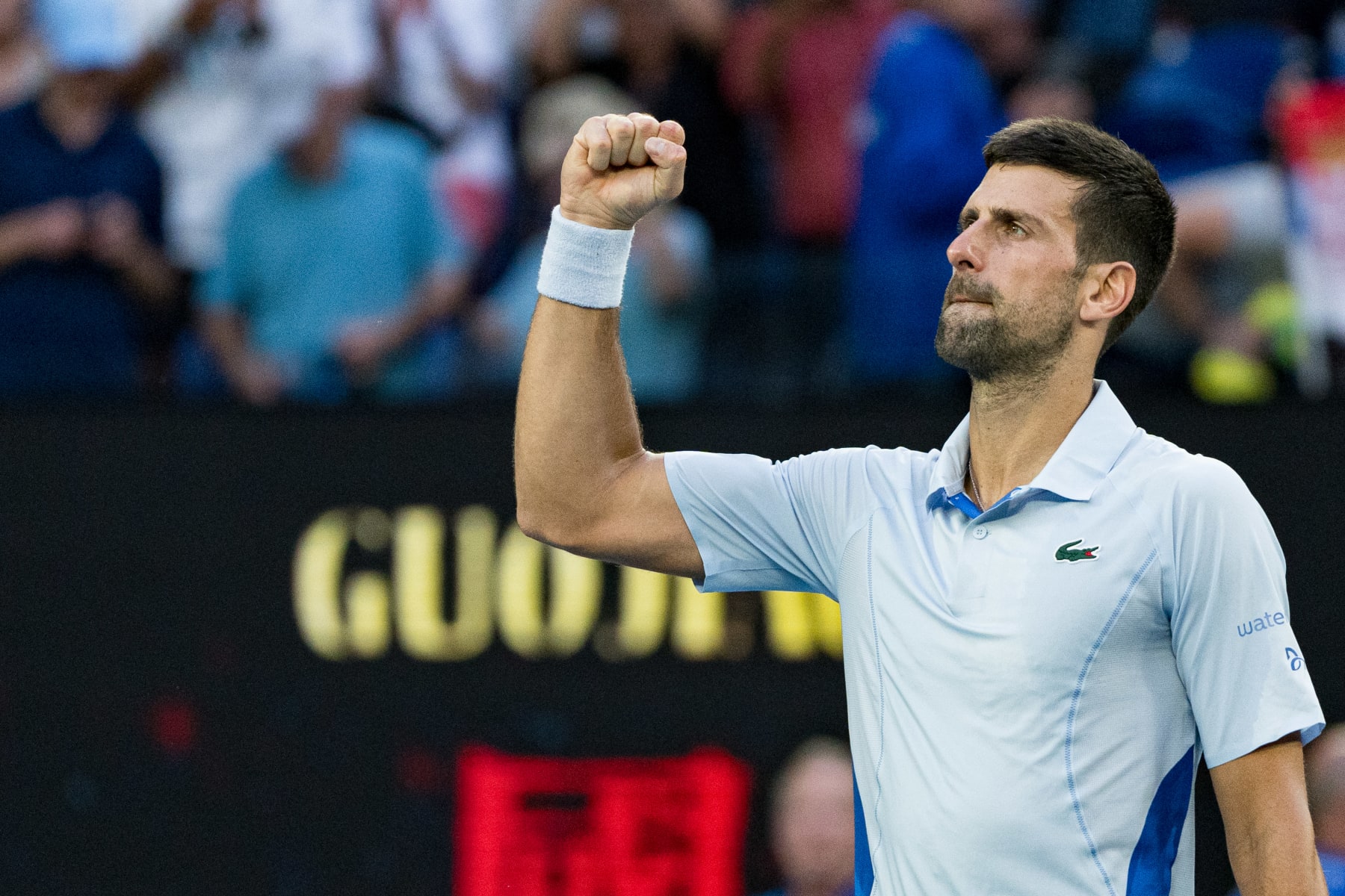 MELBOURNE, AUSTRALIA - JANUARY 23: Novak Djokovic of Serbia celebrates match point during their quarterfinals singles match against Taylor Fritz of the United States during day ten of the 2024 Australian Open at Melbourne Park on January 23, 2024 in Melbourne, Australia. (Photo by Andy Cheung/Getty Images)