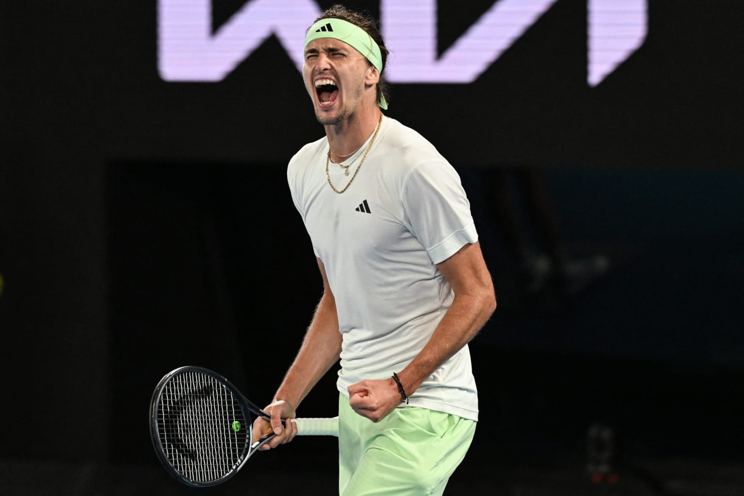 TOPSHOT - Germany's Alexander Zverev celebrates after victory against Spain's Carlos Alcaraz during their men's singles quarter-final match on day 11 of the Australian Open tennis tournament in Melbourne on January 25, 2024. (Photo by Paul Crock / AFP) / -- IMAGE RESTRICTED TO EDITORIAL USE - STRICTLY NO COMMERCIAL USE -- (Photo by PAUL CROCK/AFP via Getty Images)