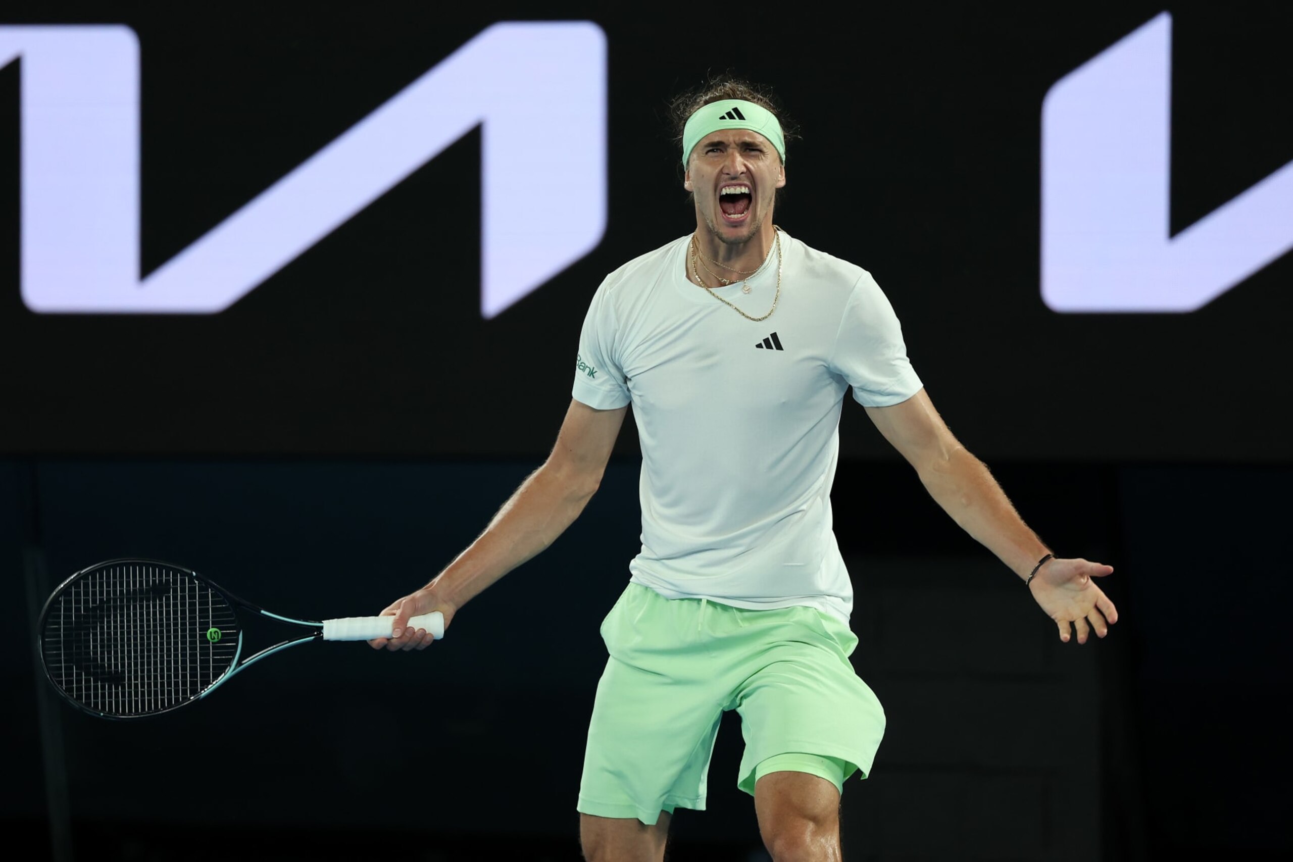 MELBOURNE, AUSTRALIA - JANUARY 24: Alexander Zverev of Germany celebrates winning match point during their quarterfinals singles match against Carlos Alcaraz of Spain during the 2024 Australian Open at Melbourne Park on January 24, 2024 in Melbourne, Australia. (Photo by Cameron Spencer/Getty Images)