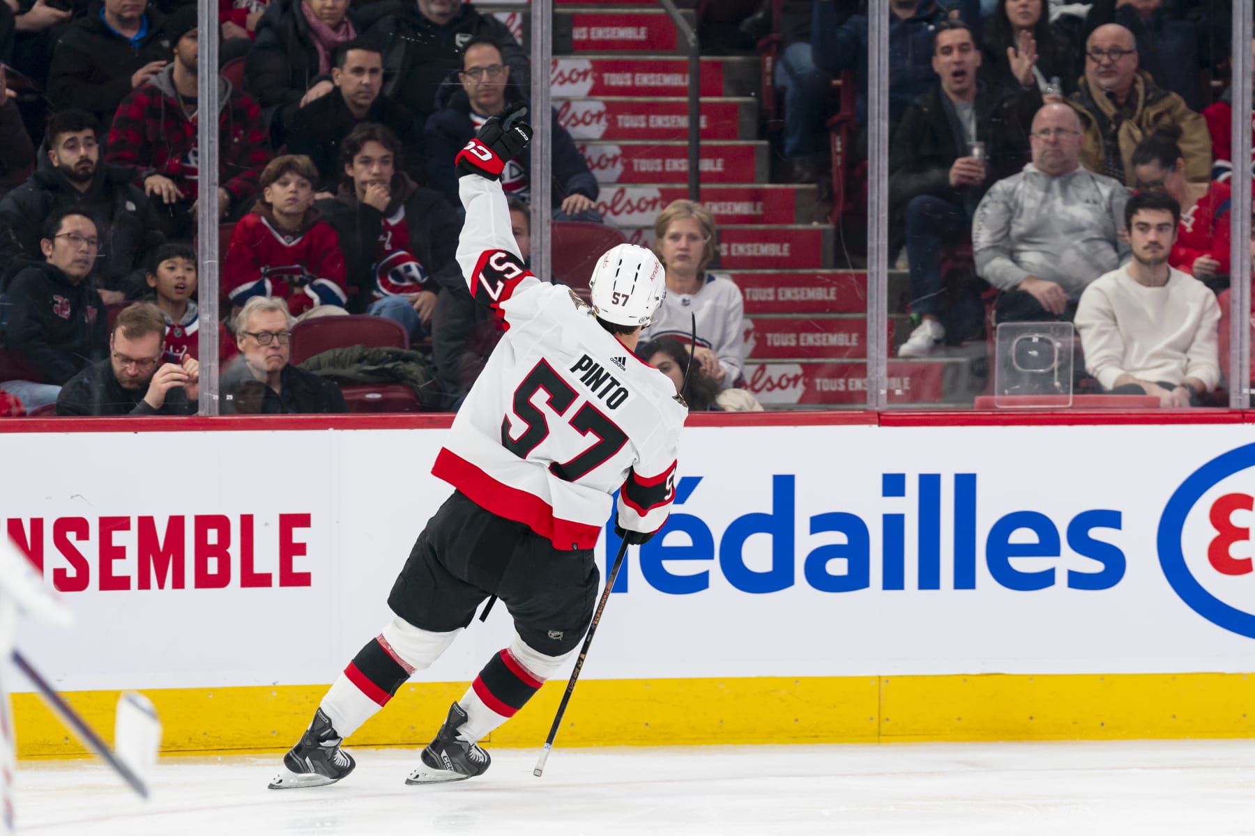MONTREAL, CANADA - JANUARY 23: Shane Pinto #57 of the Ottawa Senators celebrates after scoring a goal during the second period of the NHL regular season game between the Montreal Canadiens and the Ottawa Senators at the Bell Centre on January 23, 2024 in Montreal, Quebec, Canada. (Photo by Arianne Bergeron/NHLI via Getty Images)