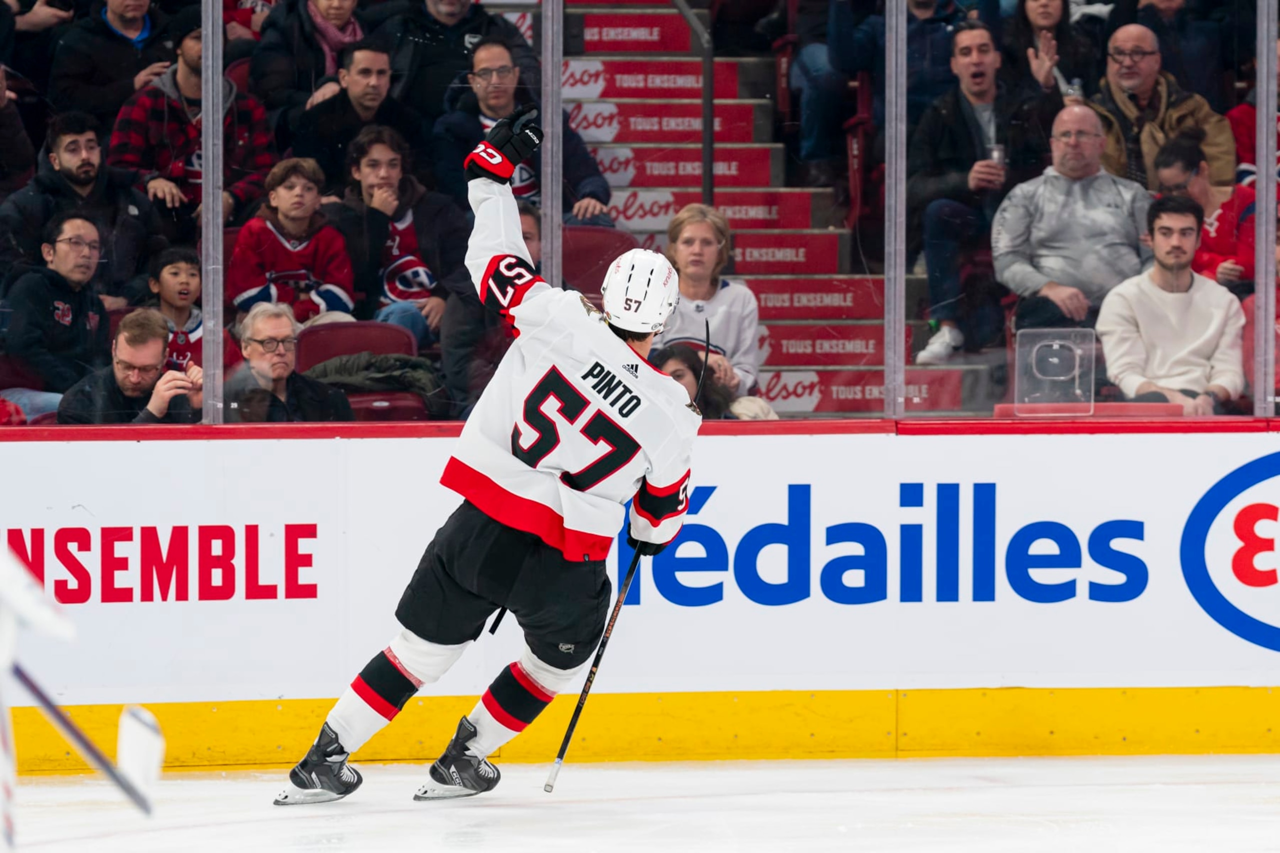 MONTREAL, CANADA - JANUARY 23: Shane Pinto #57 of the Ottawa Senators celebrates after scoring a goal during the second period of the NHL regular season game between the Montreal Canadiens and the Ottawa Senators at the Bell Centre on January 23, 2024 in Montreal, Quebec, Canada. (Photo by Arianne Bergeron/NHLI via Getty Images)