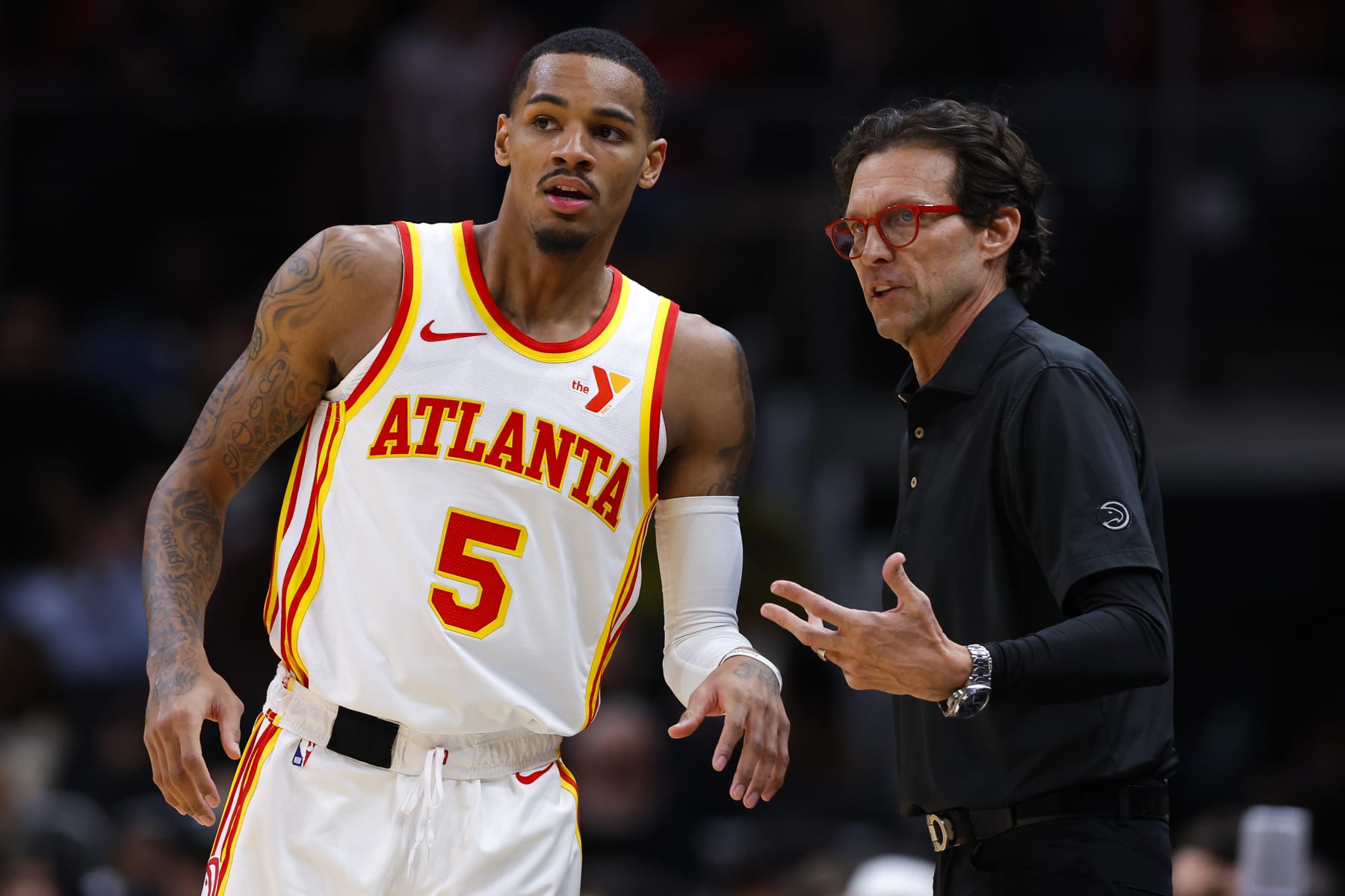 ATLANTA, GEORGIA - JANUARY 17: Head coach Quin Snyder of the Atlanta Hawks talks to Dejounte Murray #5 during the second quarter against the Orlando Magic at State Farm Arena on January 17, 2024 in Atlanta, Georgia. NOTE TO USER: User expressly acknowledges and agrees that, by downloading and or using this photograph, User is consenting to the terms and conditions of the Getty Images License Agreement. (Photo by Todd Kirkland/Getty Images)