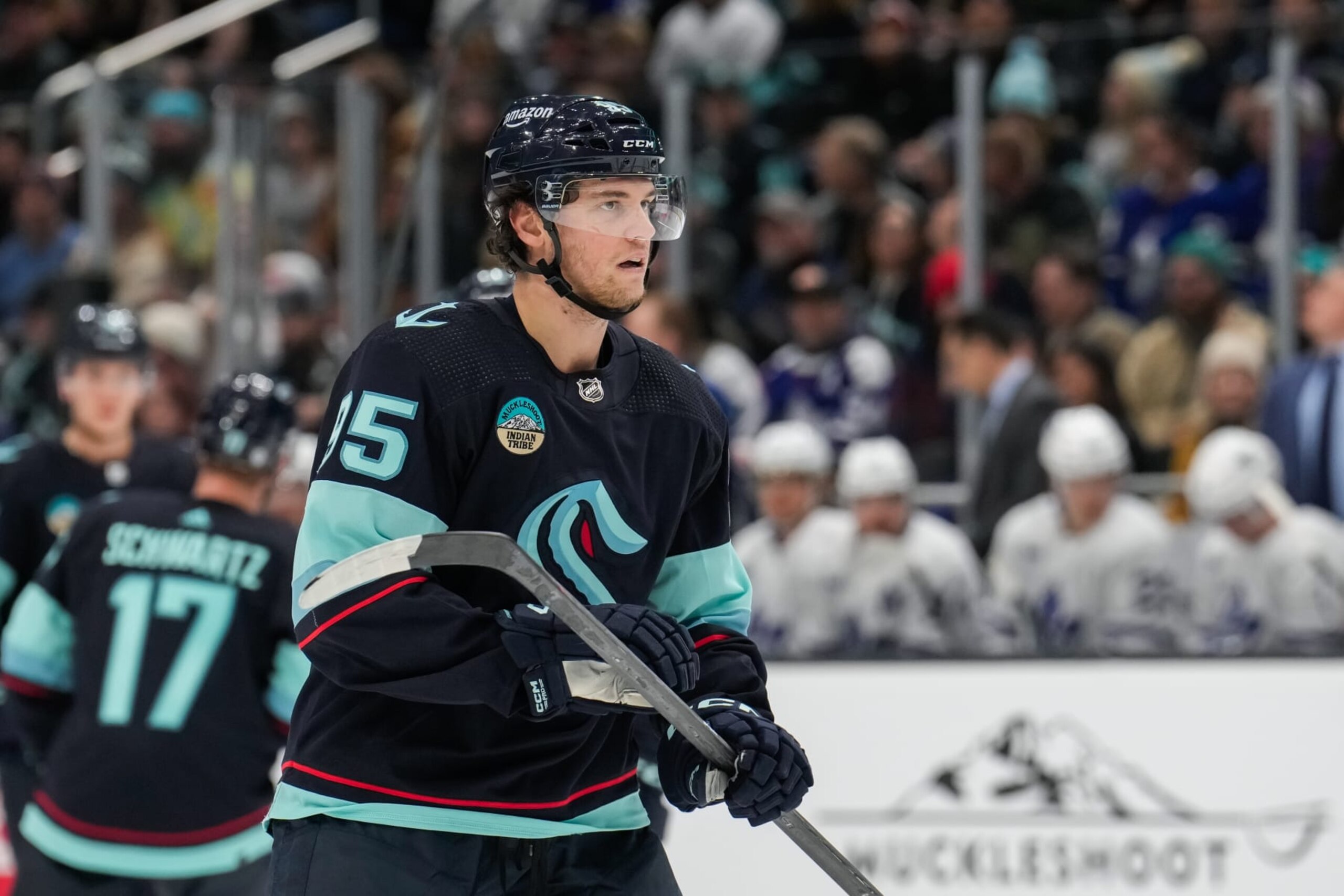 SEATTLE, WASHINGTON - JANUARY 21: Andre Burakovsky #95 of the Seattle Kraken looks on during the first period of a game against the Toronto Maple Leafs at Climate Pledge Arena on January 21, 2024 in Seattle, Washington. (Photo by Christopher Mast/NHLI via Getty Images)