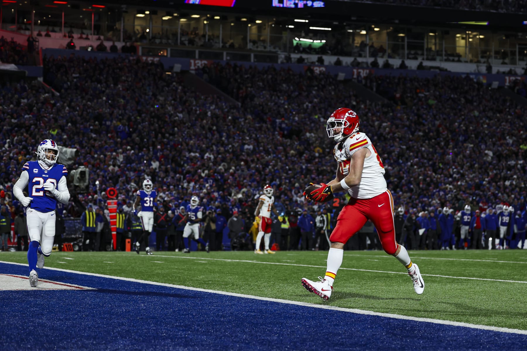 ORCHARD PARK, NY - JANUARY 21: Travis Kelce #87 of the Kansas City Chiefs scores a touchdown during an NFL divisional round playoff football game against the Buffalo Bills at Highmark Stadium on January 21, 2024 in Orchard Park, New York. (Photo by Perry Knotts/Getty Images)
