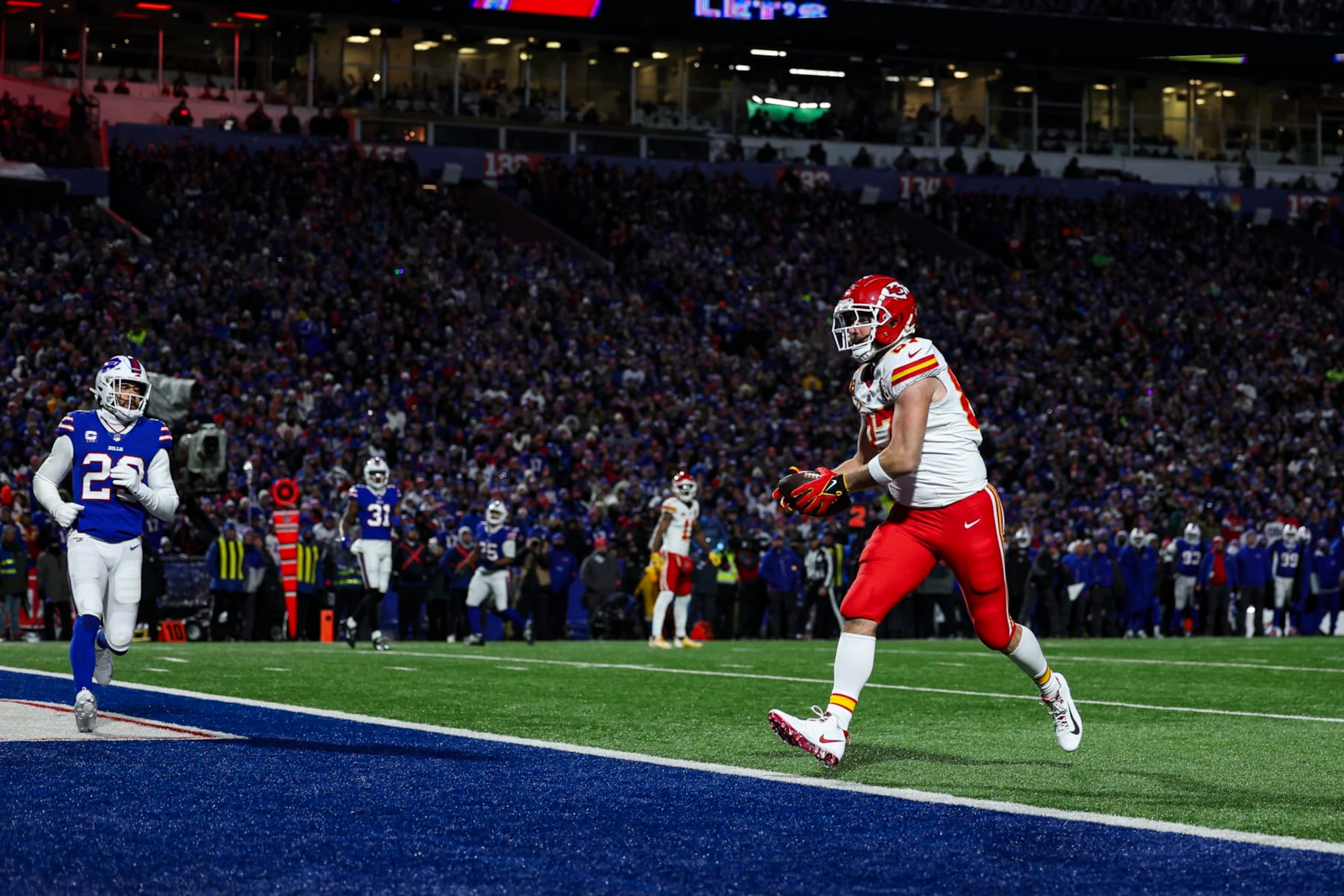 ORCHARD PARK, NY - JANUARY 21: Travis Kelce #87 of the Kansas City Chiefs scores a touchdown during an NFL divisional round playoff football game against the Buffalo Bills at Highmark Stadium on January 21, 2024 in Orchard Park, New York. (Photo by Perry Knotts/Getty Images)