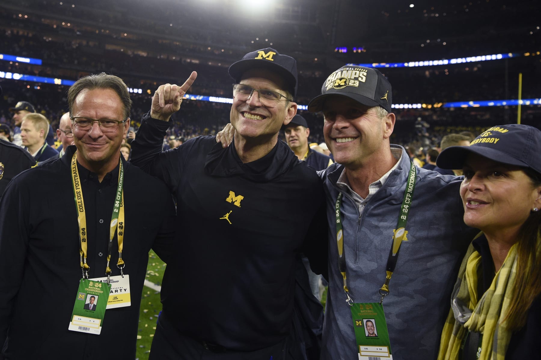 HOUSTON, TX - JANUARY 08: (L-R) Former basketball coach Tom Crean, Head Coach Jim Harbaugh of the Michigan Wolverines and his brother John Harbaugh, head coach of the Baltimore Ravens, celebrate after the Michigan Wolverines defeated the Washington Huskies in CFP National Championship game on January 8, 2024, at NRG Stadium in Houston, TX. (Photo by Ken Murray/Icon Sportswire via Getty Images)