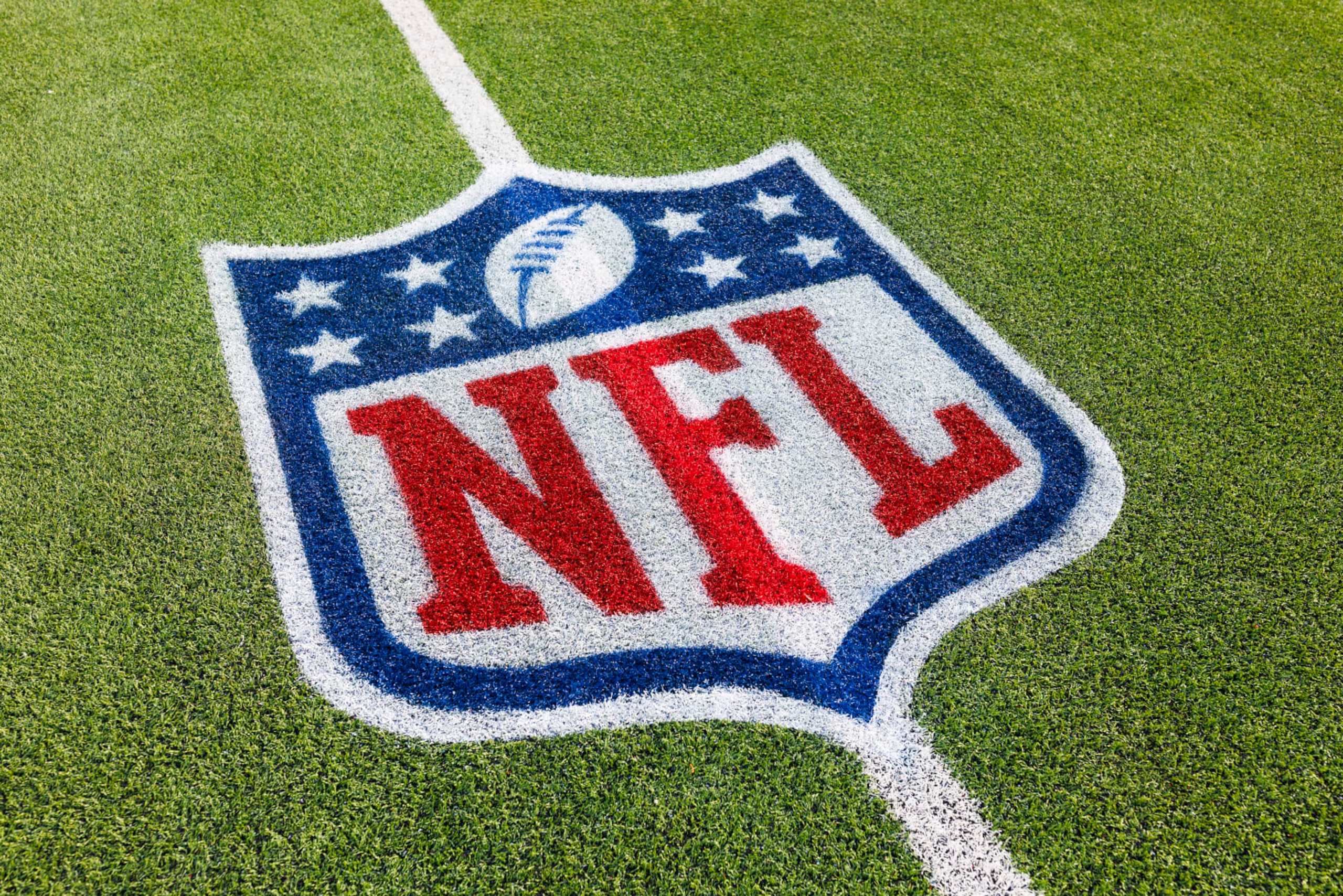 INGLEWOOD, CALIFORNIA - JANUARY 7: A detailed view of an NFL shield logo painted on the field during a game against the Kansas City Chiefs and the Los Angeles Chargers at SoFi Stadium on January 7, 2024 in Inglewood, California. (Photo by Ric Tapia/Getty Images)