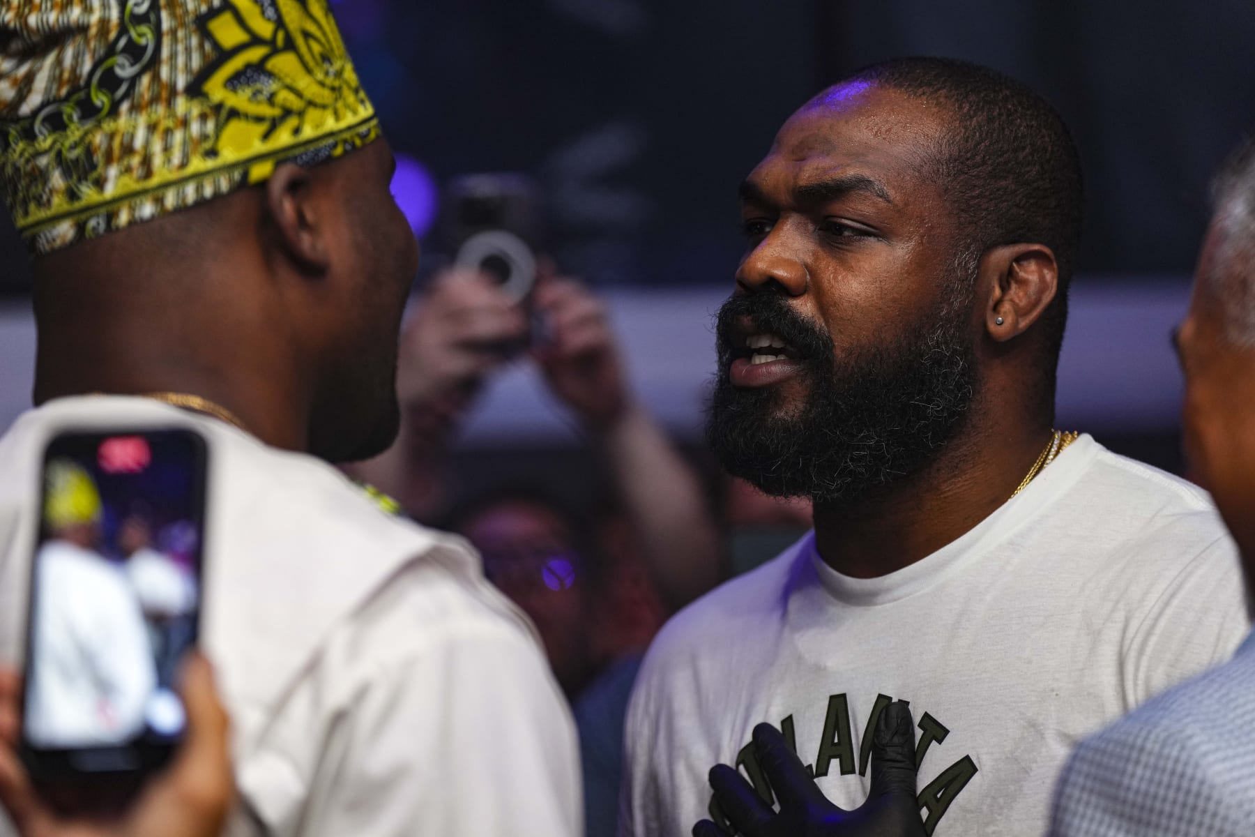 ATLANTA, GA - JUNE 17: Jon Jones has words with Francis Ngannou during PFL 2023 week 5 at OTE Arena on June 17, 2023 in Atlanta, Georgia. (Photo by Cooper Neill/Getty Images)