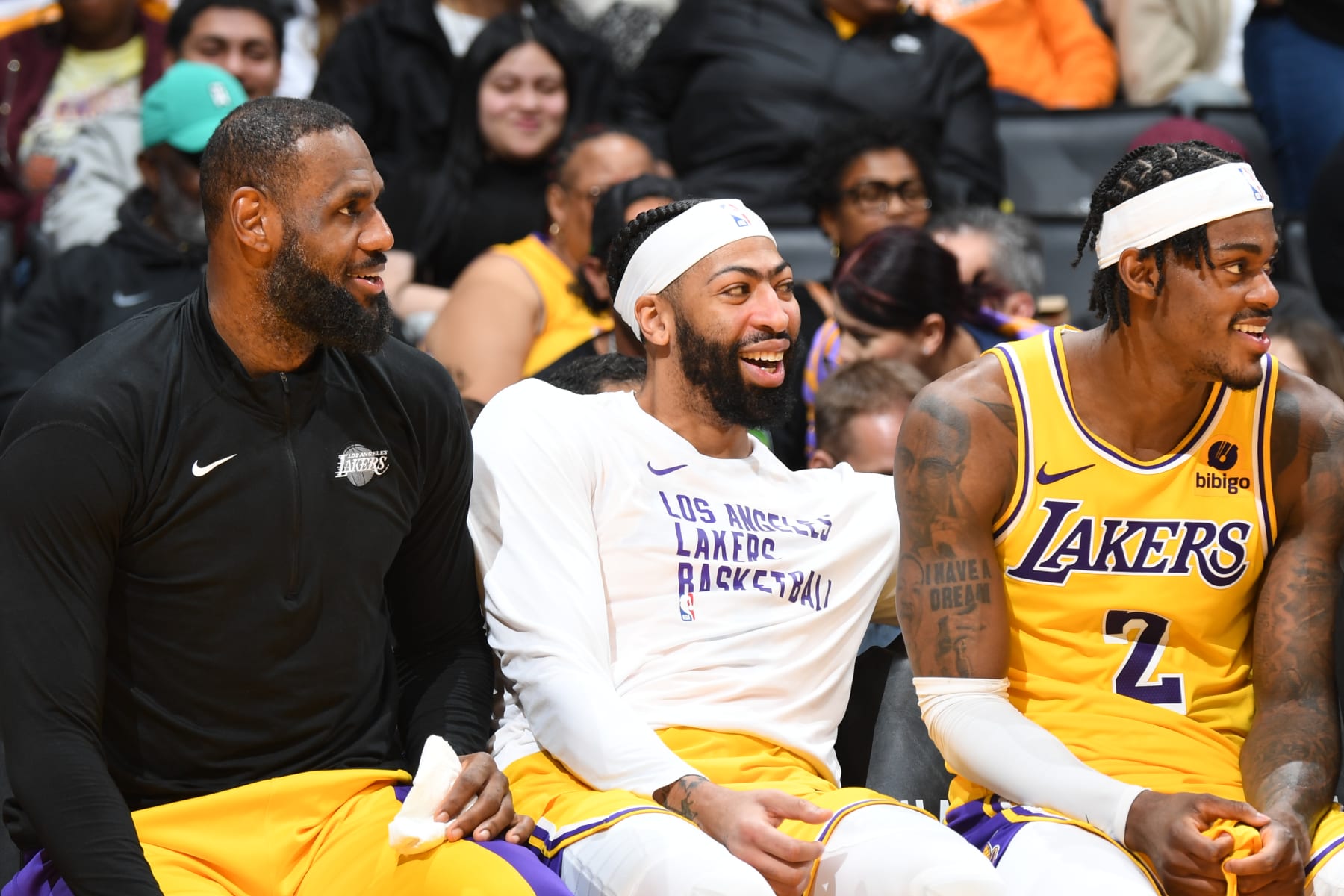 LOS ANGELES, CA - JANUARY 17:  LeBron James #23 of the Los Angeles Lakers  Anthony Davis #3 of the Los Angeles Lakers & Jarred Vanderbilt #2 of the Los Angeles Lakers smile and look on during the game on January 17, 2024 at Crypto.Com Arena in Los Angeles, California. NOTE TO USER: User expressly acknowledges and agrees that, by downloading and/or using this Photograph, user is consenting to the terms and conditions of the Getty Images License Agreement. Mandatory Copyright Notice: Copyright 2024 NBAE (Photo by Andrew D. Bernstein/NBAE via Getty Images)