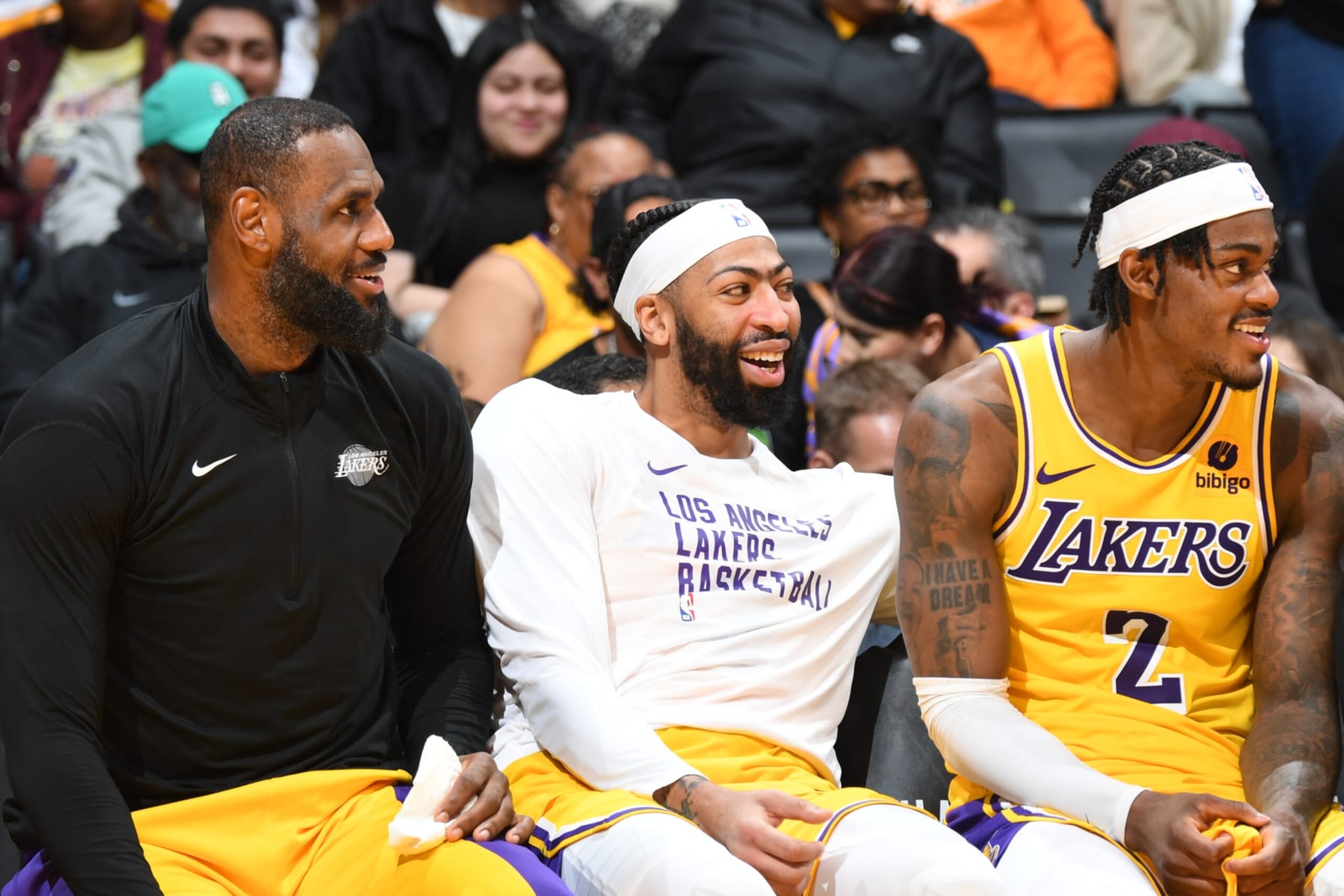 LOS ANGELES, CA - JANUARY 17:  LeBron James #23 of the Los Angeles Lakers  Anthony Davis #3 of the Los Angeles Lakers & Jarred Vanderbilt #2 of the Los Angeles Lakers smile and look on during the game on January 17, 2024 at Crypto.Com Arena in Los Angeles, California. NOTE TO USER: User expressly acknowledges and agrees that, by downloading and/or using this Photograph, user is consenting to the terms and conditions of the Getty Images License Agreement. Mandatory Copyright Notice: Copyright 2024 NBAE (Photo by Andrew D. Bernstein/NBAE via Getty Images)