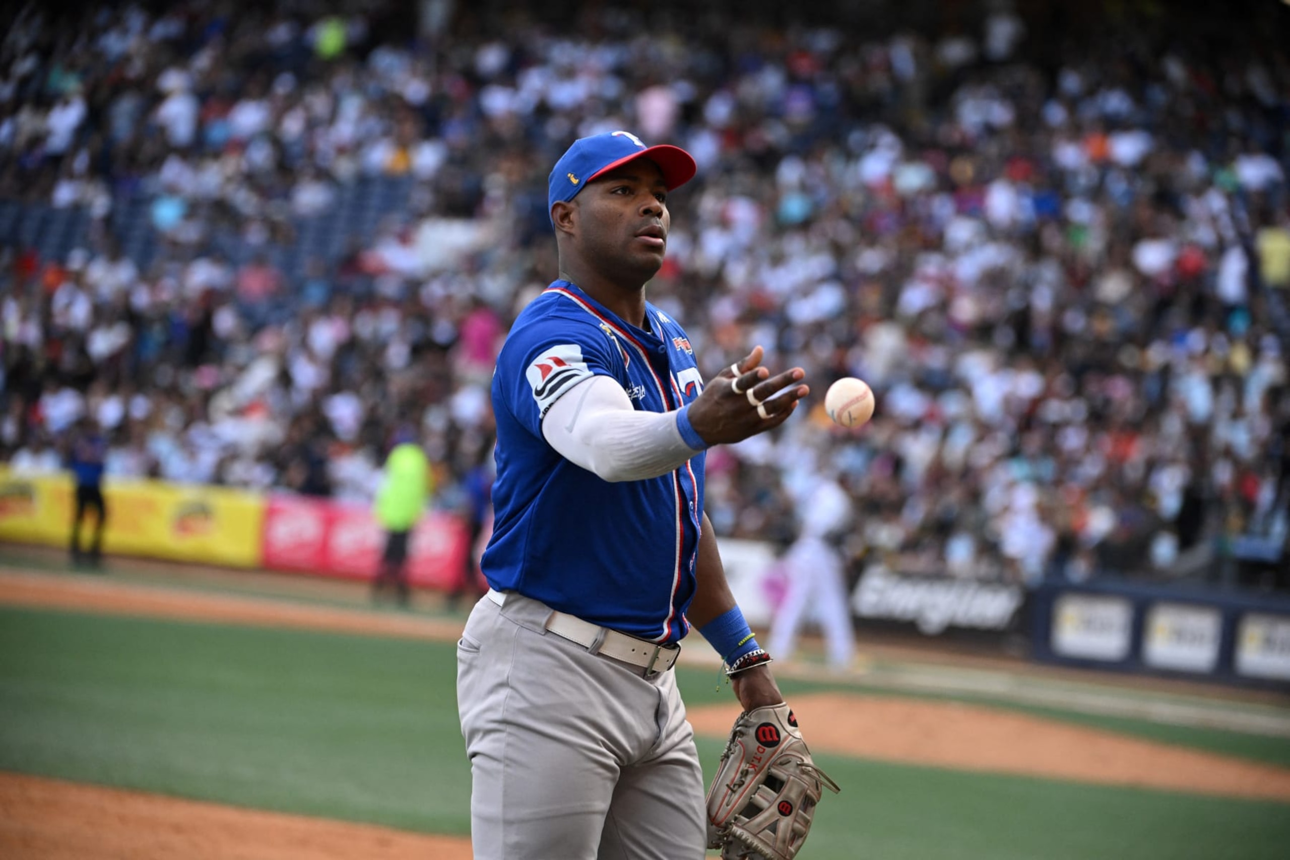 Tiburones de la Guaira's Cuban baseball player Yasiel Puig throws the ball during the Venezuelan Baseball League game between Leones del Caracas and Tiburones de la Guaira at the Simon Bolivar Monumental Stadium in Caracas, on January 7, 2024. (Photo by Federico PARRA / AFP) (Photo by FEDERICO PARRA/AFP via Getty Images)