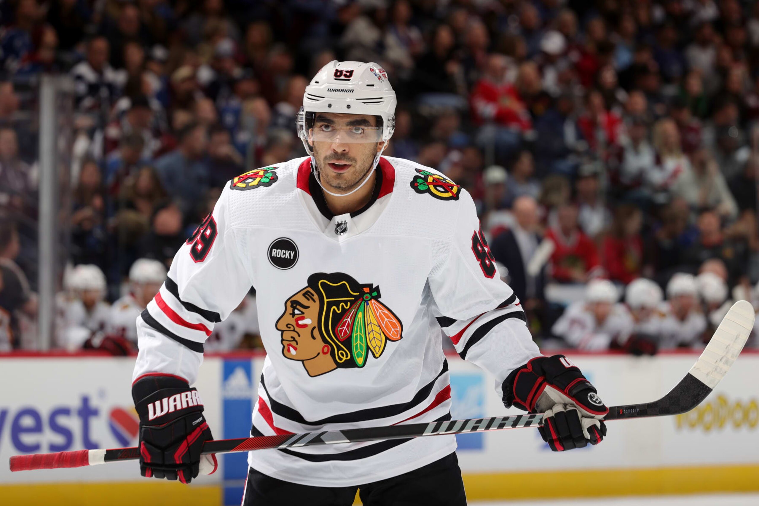 DENVER, COLORADO - OCTOBER 19: Andreas Athanasiou #89 of the Chicago Blackhawks awaits a faceoff during a game against the Colorado Avalanche at Ball Arena on October 19, 2023 in Denver, Colorado. (Photo by Michael Martin/NHLI via Getty Images)