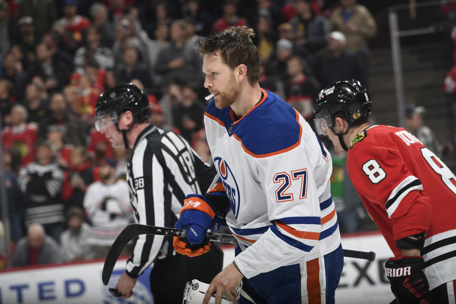 CHICAGO, ILLINOIS - JANUARY 09: Brett Kulak #27 of the Edmonton Oilers skates across the ice after a scuffle with the Chicago Blackhawks in the first period at the United Center on January 09, 2024 in Chicago, Illinois. (Photo by Bill Smith/NHLI via Getty Images)