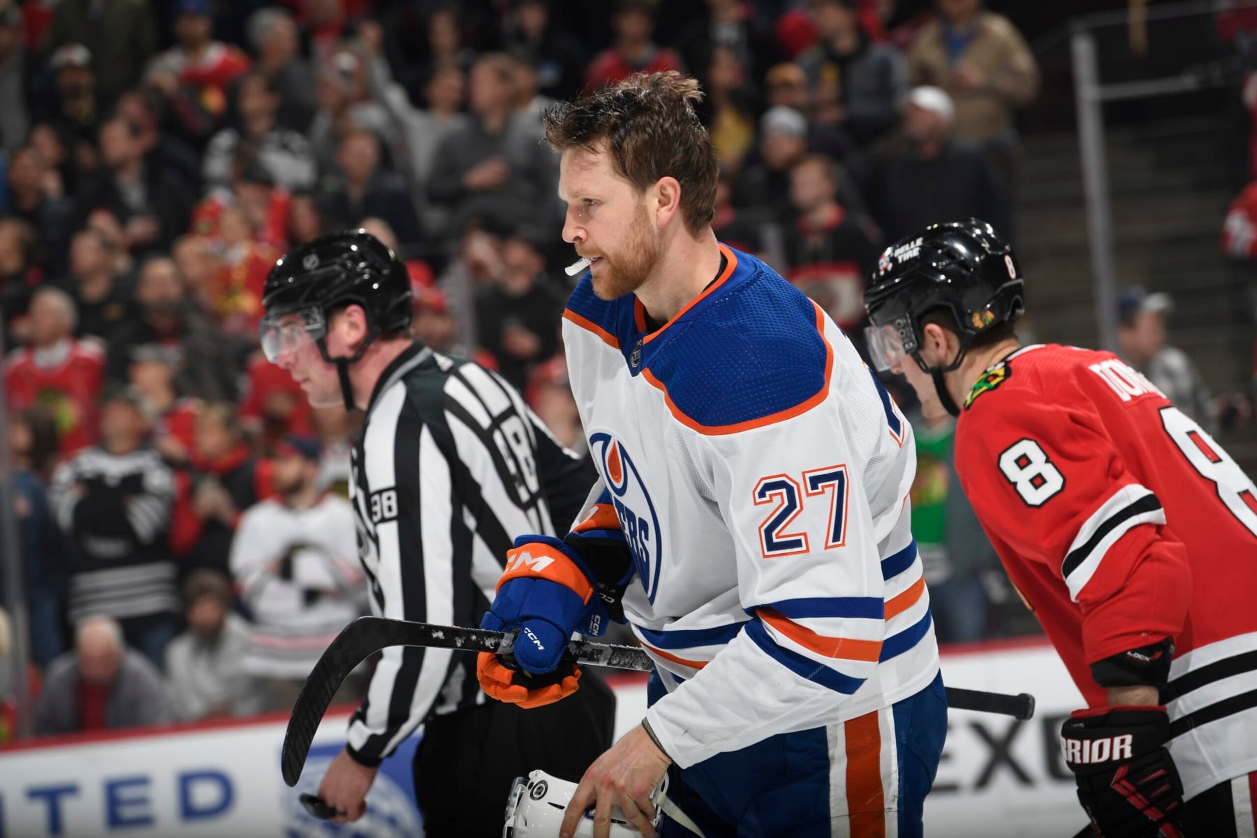 CHICAGO, ILLINOIS - JANUARY 09: Brett Kulak #27 of the Edmonton Oilers skates across the ice after a scuffle with the Chicago Blackhawks in the first period at the United Center on January 09, 2024 in Chicago, Illinois. (Photo by Bill Smith/NHLI via Getty Images)