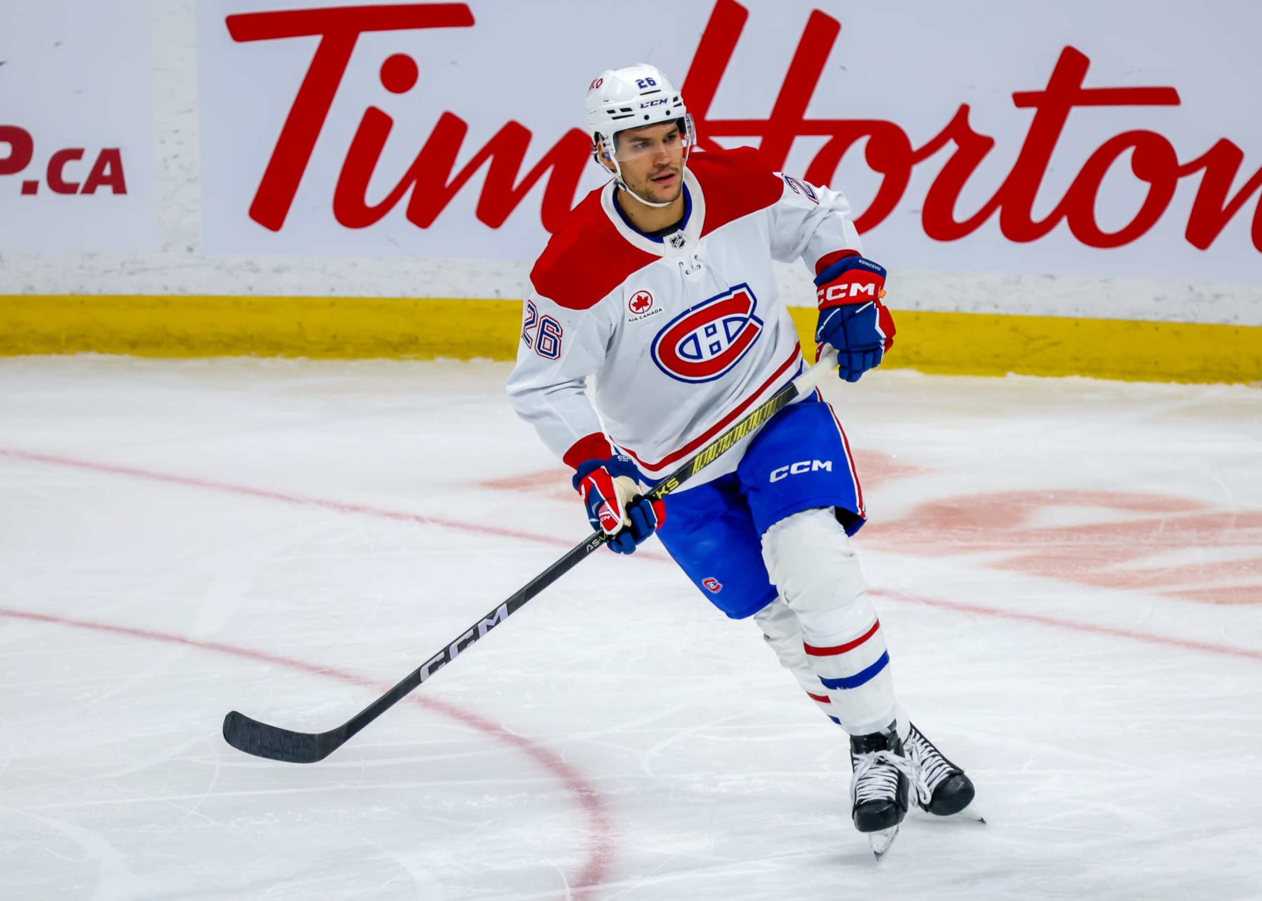 WINNIPEG, CANADA - DECEMBER 18: Johnathan Kovacevic #26 of the Montreal Canadiens skates during second period action against the Winnipeg Jets at Canada Life Centre on December 18, 2023 in Winnipeg, Manitoba, Canada. (Photo by Jonathan Kozub/NHLI via Getty Images)