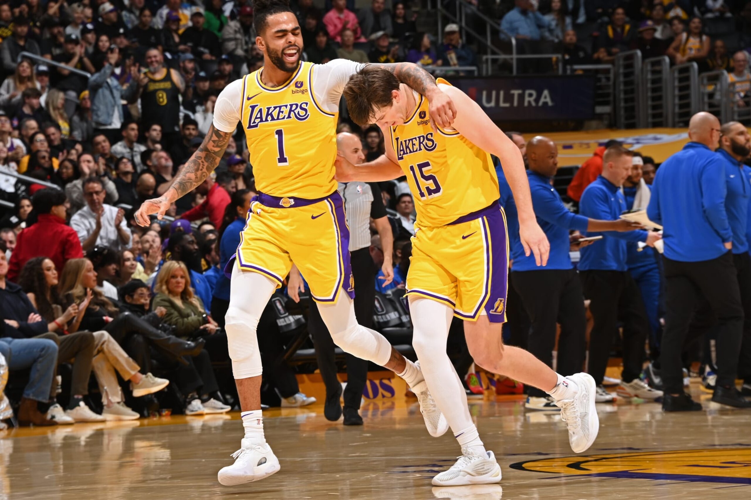LOS ANGELES, CA - JANUARY 17: D'Angelo Russell #1 and Austin Reaves #15 of the Los Angeles Lakers look on during the game against the Dallas Mavericks on January 17, 2024 at Crypto.Com Arena in Los Angeles, California. NOTE TO USER: User expressly acknowledges and agrees that, by downloading and/or using this Photograph, user is consenting to the terms and conditions of the Getty Images License Agreement. Mandatory Copyright Notice: Copyright 2024 NBAE (Photo by Andrew D. Bernstein/NBAE via Getty Images)