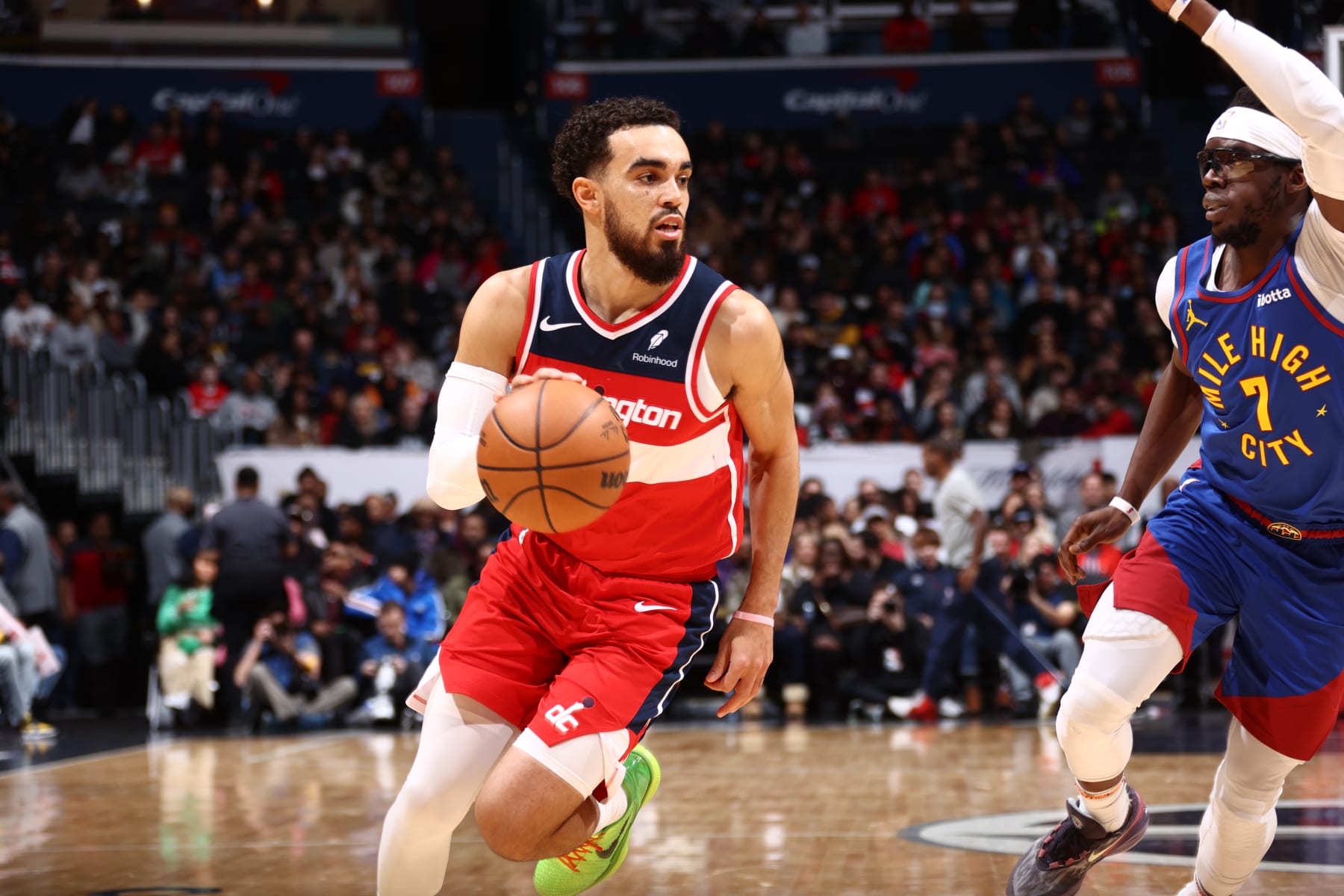 WASHINGTON, DC -  JANUARY 21: Tyus Jones #5 of the Washington Wizards dribbles the ball during the game against the Denver Nuggets on January 21, 2024 at Capital One Arena in Washington, DC. NOTE TO USER: User expressly acknowledges and agrees that, by downloading and or using this Photograph, user is consenting to the terms and conditions of the Getty Images License Agreement. Mandatory Copyright Notice: Copyright 2024 NBAE (Photo by Kenny Giarla/NBAE via Getty Images)
