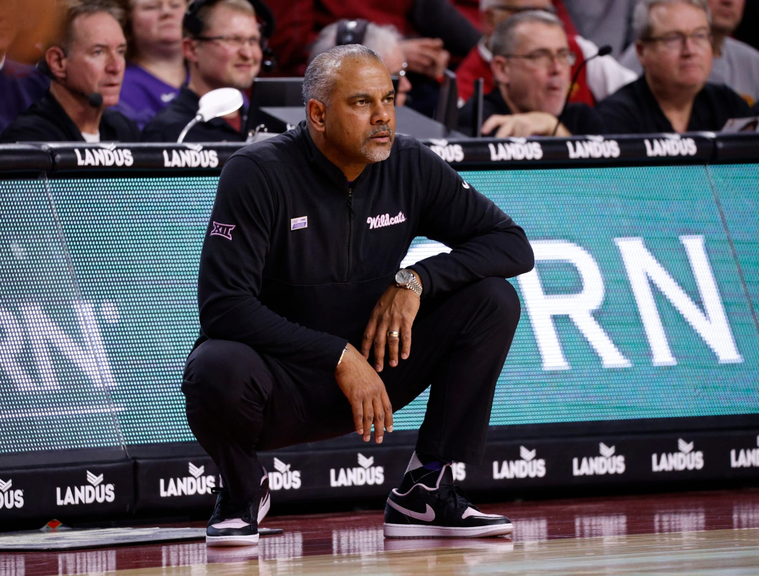 AMES, IA - JANUARY 24: Head coach Jerome Tang of the Kansas State Wildcats coaches from the bench in the first half of play at Hilton Coliseum on January 24, 2024 in Ames, Iowa. The Iowa State Cyclones won 78-67 over the Kansas State Wildcats. (Photo by David K Purdy/Getty Images)