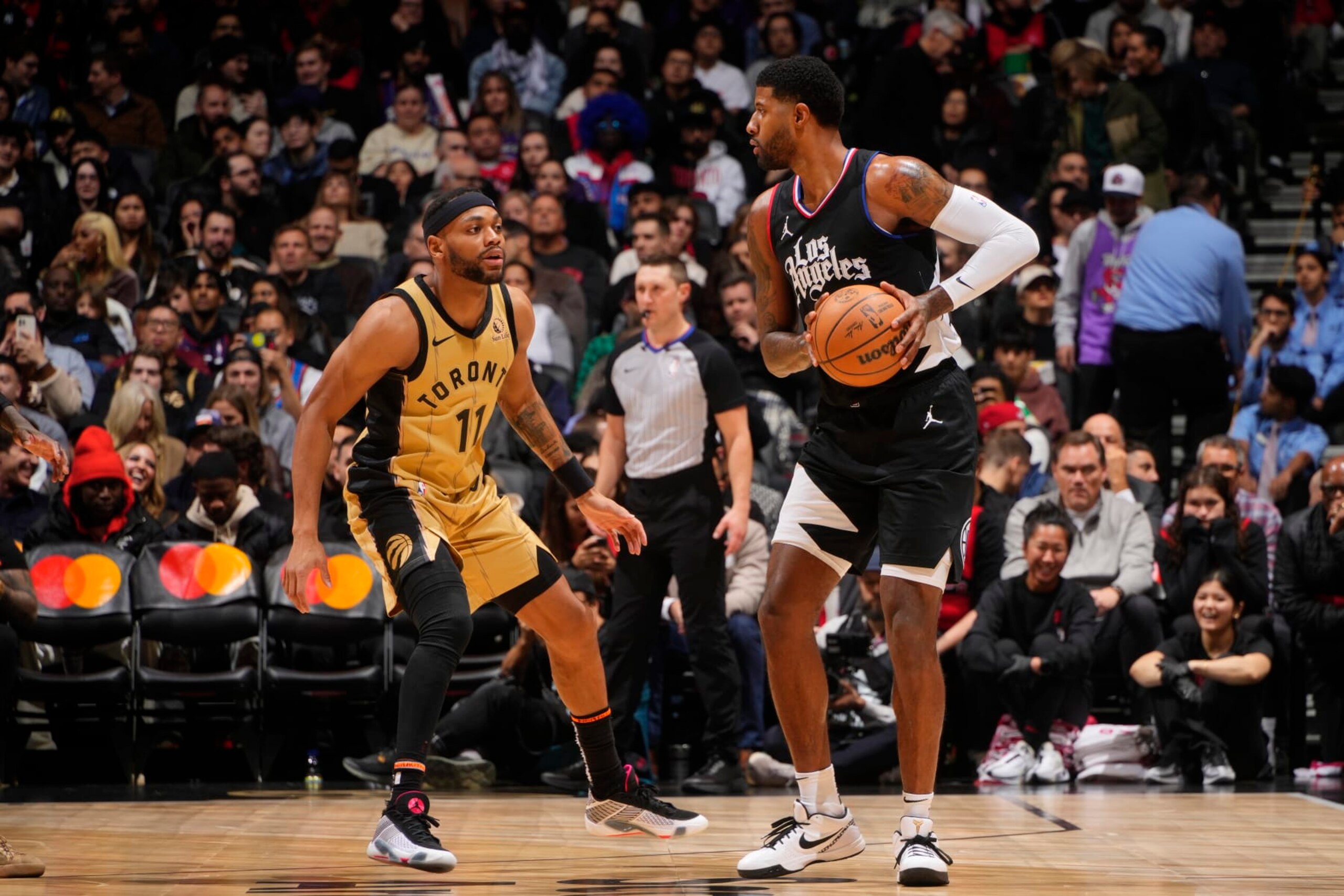 TORONTO, CANADA - JANUARY 26: Paul George #13 of the LA Clippers looks to pass the ball during the game against the Toronto Raptors on January 26, 2024 at the Scotiabank Arena in Toronto, Ontario, Canada. NOTE TO USER: User expressly acknowledges and agrees that, by downloading and or using this Photograph, user is consenting to the terms and conditions of the Getty Images License Agreement. Mandatory Copyright Notice: Copyright 2024 NBAE (Photo by Mark Blinch/NBAE via Getty Images) TORONTO, CANADA - JANUARY 26: Paul George #13 of the LA Clippers looks to pass the ball during the game against the Toronto Raptors on January 26, 2024 at the Scotiabank Arena in Toronto, Ontario, Canada. NOTE TO USER: User expressly acknowledges and agrees that, by downloading and or using this Photograph, user is consenting to the terms and conditions of the Getty Images License Agreement. Mandatory Copyright Notice: Copyright 2024 NBAE (Photo by Mark Blinch/NBAE via Getty Images)
