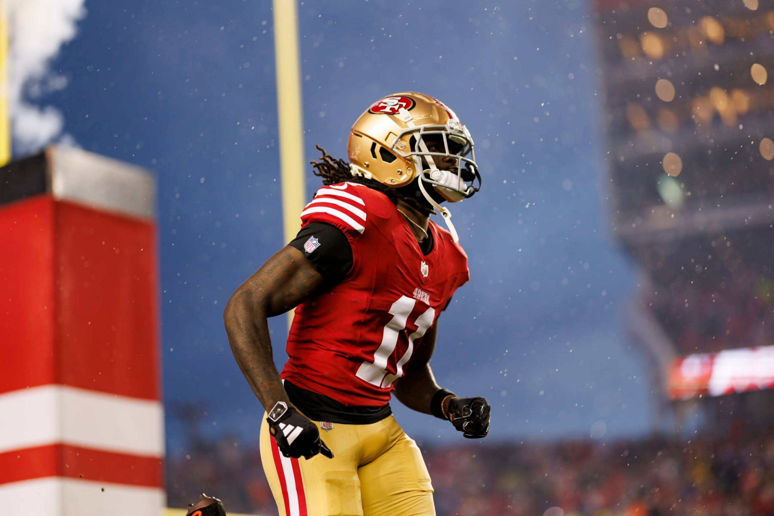 SANTA CLARA, CALIFORNIA - JANUARY 20: Brandon Aiyuk #11 of the San Francisco 49ers runs onto the field during player introductions before an NFC divisional round playoff football game against the Green Bay Packers at Levi's Stadium on January 20, 2024 in Santa Clara, California. (Photo by Ryan Kang/Getty Images)