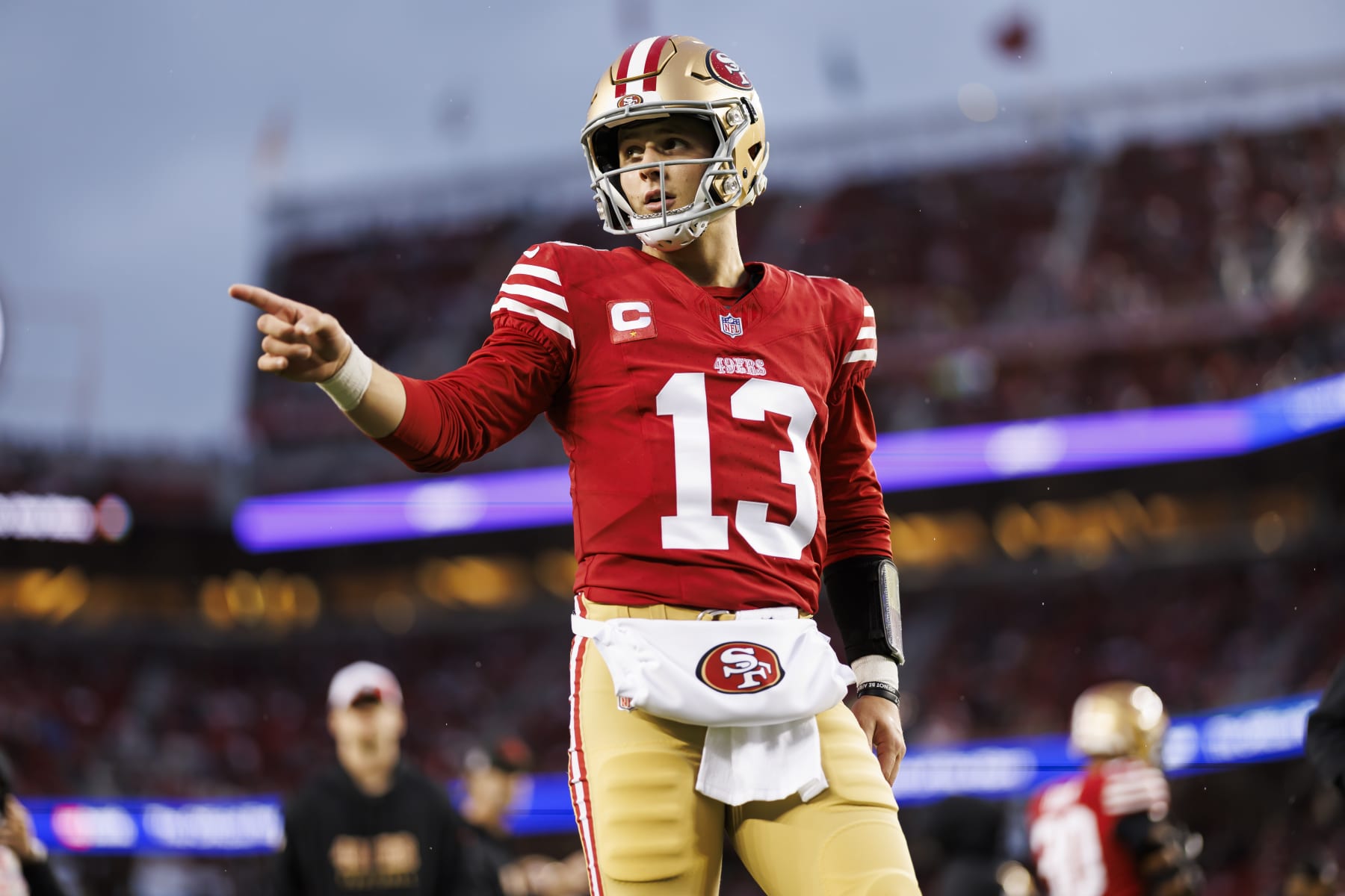SANTA CLARA, CALIFORNIA - JANUARY 20: Brock Purdy #13 of the San Francisco 49ers points during pregame warmups before an NFC divisional round playoff football game against the Green Bay Packers at Levi's Stadium on January 20, 2024 in Santa Clara, California. (Photo by Ryan Kang/Getty Images)