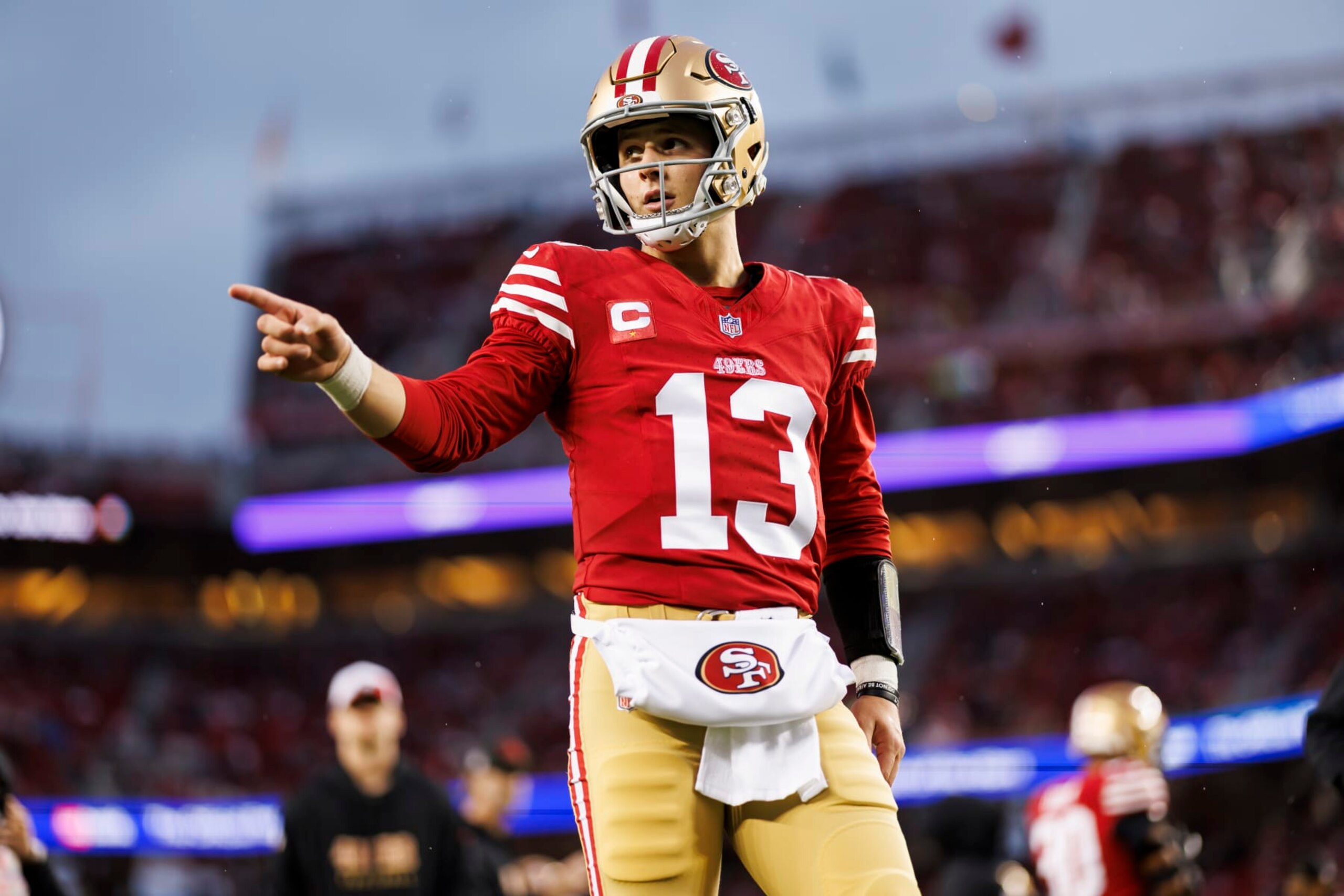 SANTA CLARA, CALIFORNIA - JANUARY 20: Brock Purdy #13 of the San Francisco 49ers points during pregame warmups before an NFC divisional round playoff football game against the Green Bay Packers at Levi's Stadium on January 20, 2024 in Santa Clara, California. (Photo by Ryan Kang/Getty Images)