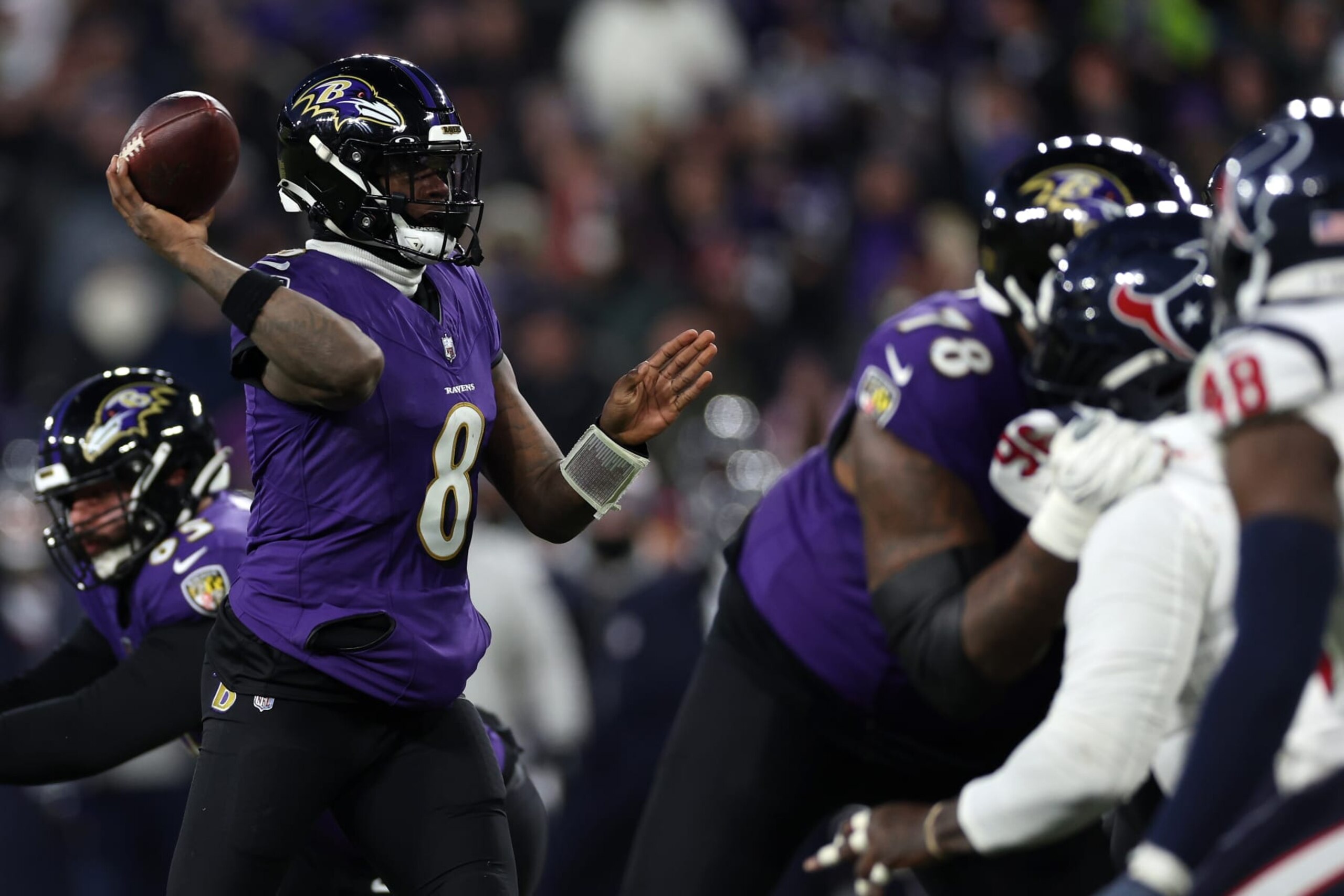 BALTIMORE, MARYLAND - JANUARY 20: Quarterback Lamar Jackson #8 of the Baltimore Ravens passes the ball against the Houston Texans during the second quarter in the AFC Divisional Playoff game at M&T Bank Stadium on January 20, 2024 in Baltimore, Maryland. (Photo by Patrick Smith/Getty Images)