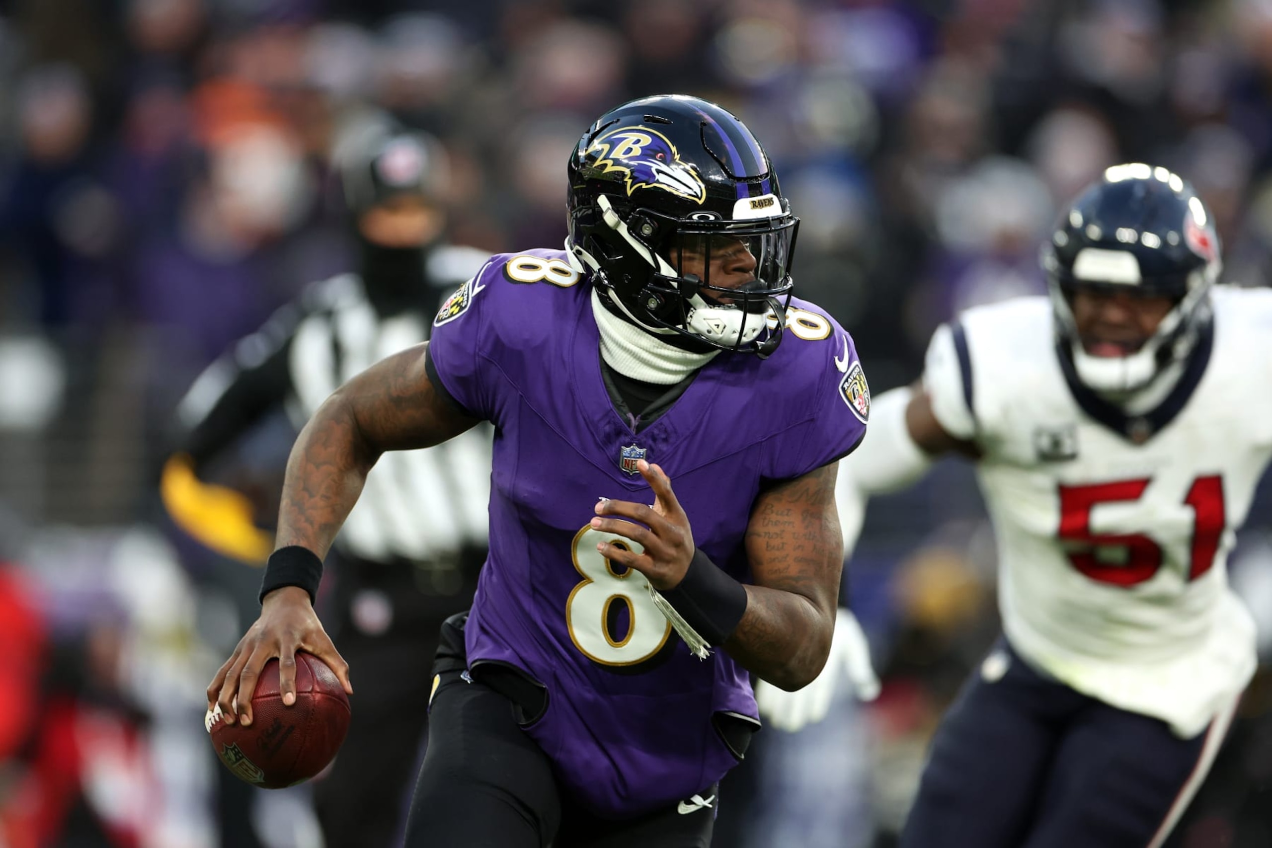 BALTIMORE, MARYLAND - JANUARY 20: Quarterback Lamar Jackson #8 of the Baltimore Ravens looks to pass against the Houston Texans during the AFC Divisional Playoff game at M&T Bank Stadium on January 20, 2024 in Baltimore, Maryland. (Photo by Rob Carr/Getty Images) BALTIMORE, MARYLAND - JANUARY 20: Quarterback Lamar Jackson #8 of the Baltimore Ravens looks to pass against the Houston Texans during the AFC Divisional Playoff game at M&T Bank Stadium on January 20, 2024 in Baltimore, Maryland. (Photo by Rob Carr/Getty Images)