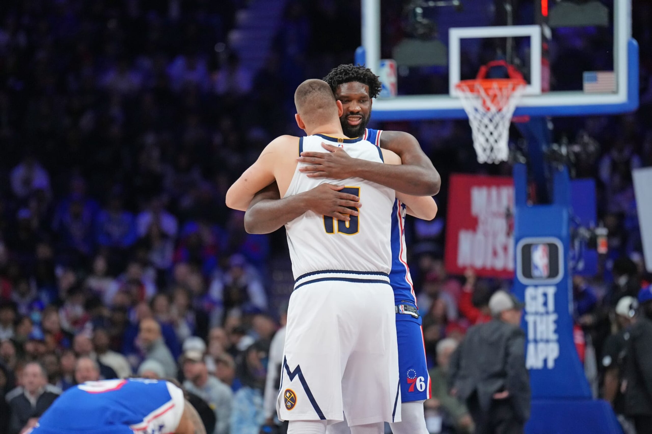 PHILADELPHIA, PA - JANUARY 16: Nikola Jokic #15 of the Denver Nuggets hugs Joel Embiid #21 of the Philadelphia 76ers before the game on January 16, 2023 at the Wells Fargo Center in Philadelphia, Pennsylvania NOTE TO USER: User expressly acknowledges and agrees that, by downloading and/or using this Photograph, user is consenting to the terms and conditions of the Getty Images License Agreement. Mandatory Copyright Notice: Copyright 2024 NBAE (Photo by Jesse D. Garrabrant/NBAE via Getty Images)
