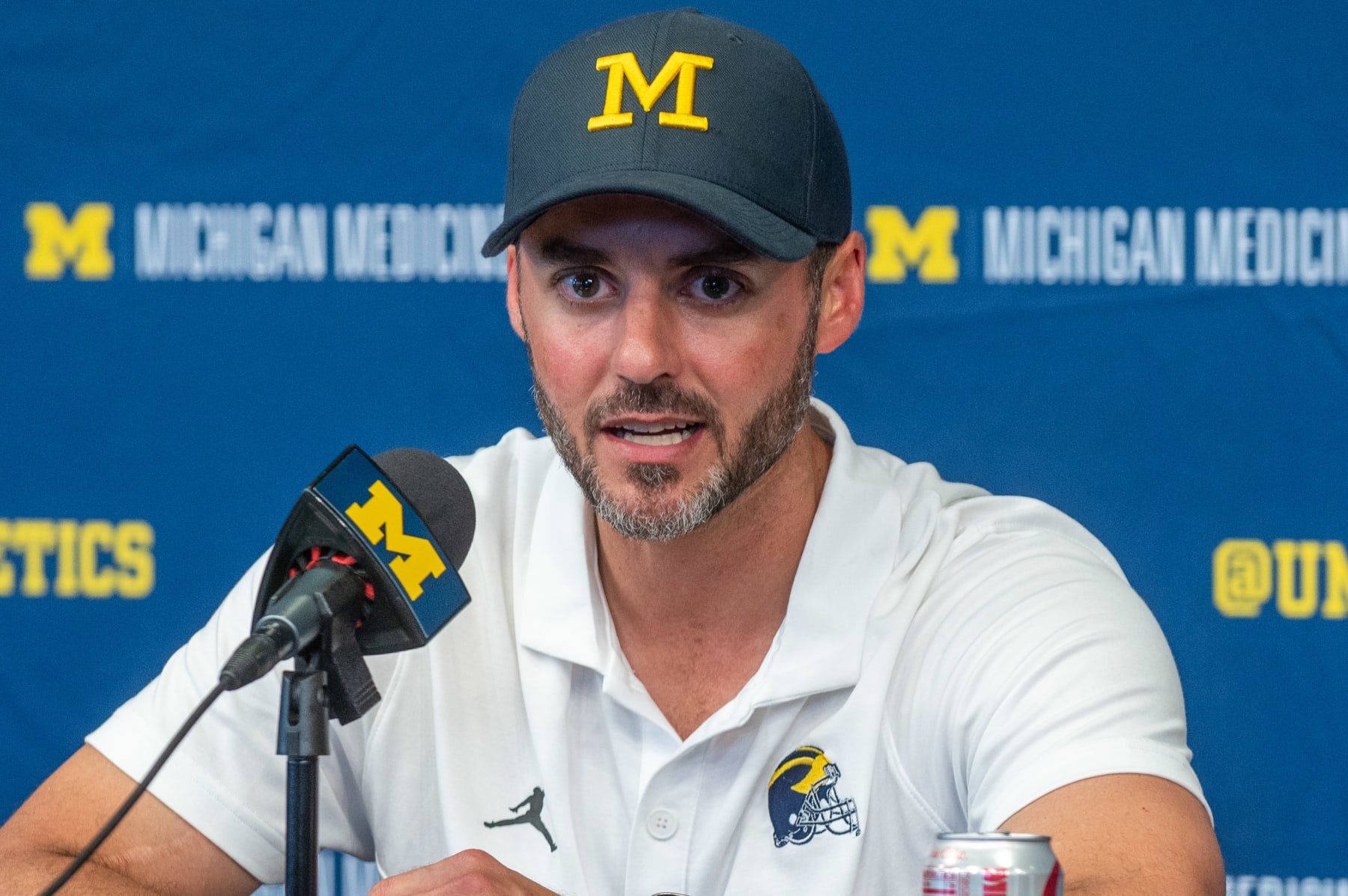 ANN ARBOR, MICHIGAN - SEPTEMBER 02: Acting Head Football Coach Jesse Minter of the Michigan Wolverines speaks to media during the post game press conference after a college football game against the East Carolina Pirates at Michigan Stadium on September 02, 2023 in Ann Arbor, Michigan. The Michigan Wolverines won the game 30-3. (Photo by Aaron J. Thornton/Getty Images)
