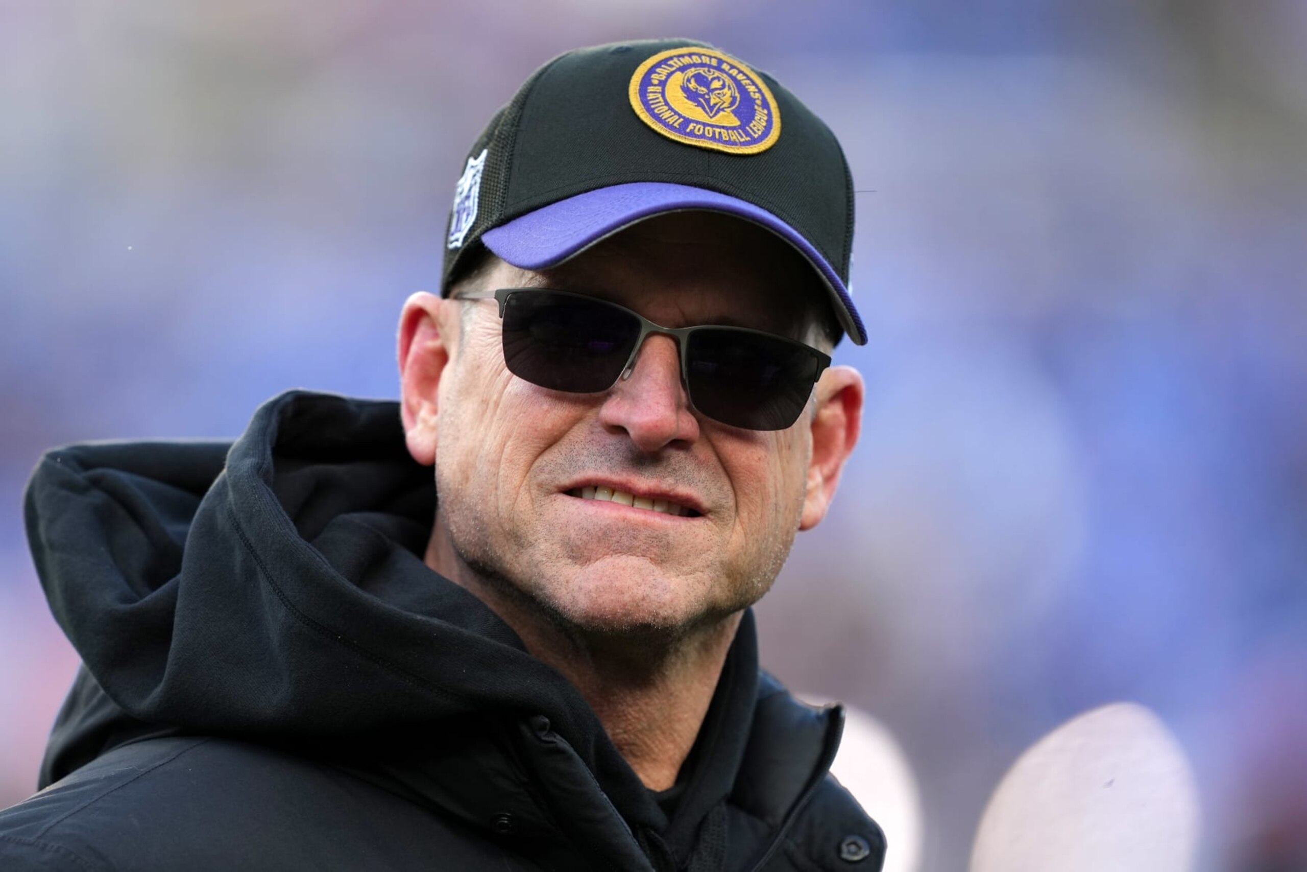 BALTIMORE, MARYLAND, JANUARY 20: Coach Jim Harbaugh of the Michigan Wolverines attends the AFC Divisional Playoff game between the Baltimore Ravens and the Houston Texans at M&T Bank Stadium on January 20, 2024 in Baltimore, Maryland. (Photo by Kirby Lee/Getty Images)