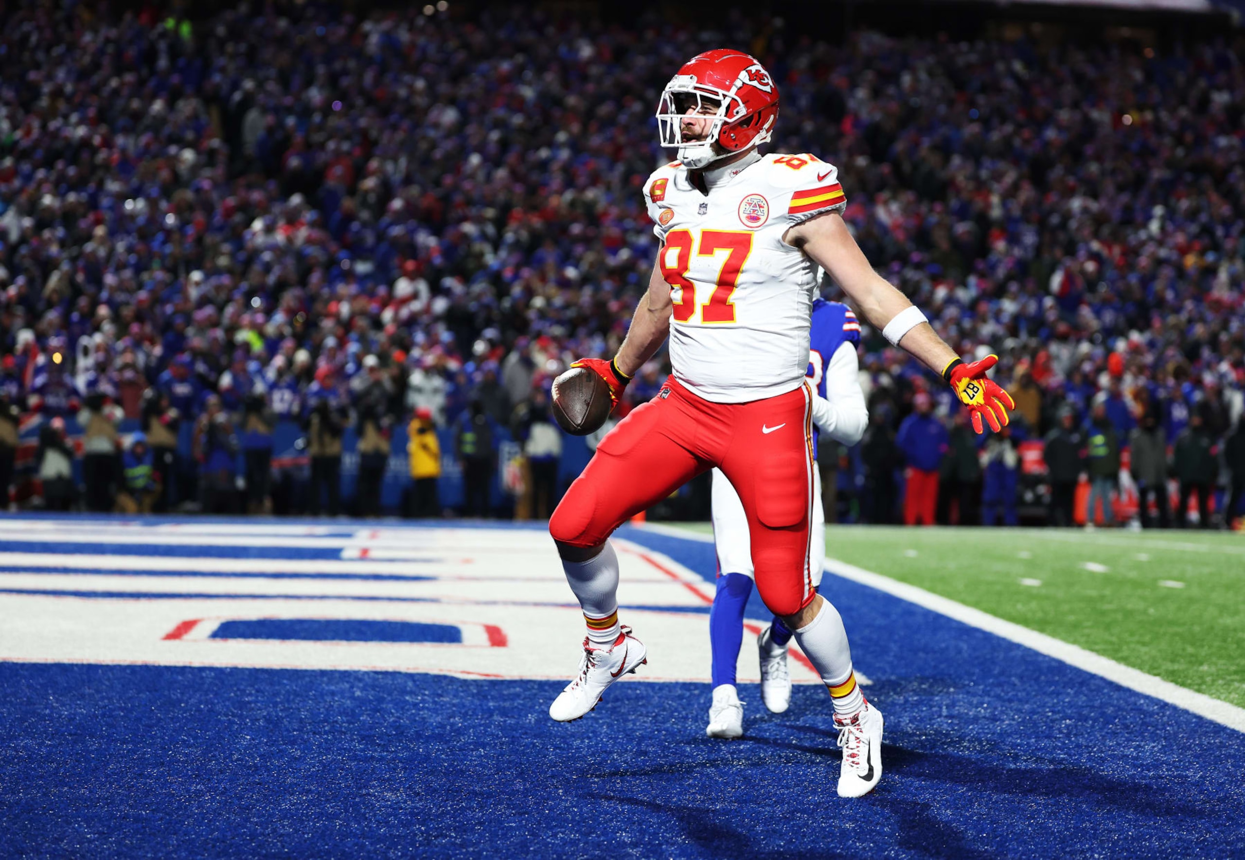 ORCHARD PARK, NEW YORK - JANUARY 21:  1 #87 of the Kansas City Chiefs celebrates after scoring a 22 yard touchdown against the Buffalo Bills during the second quarter in the AFC Divisional Playoff game at Highmark Stadium on January 21, 2024 in Orchard Park, New York.  (Photo by Al Bello/Getty Images)