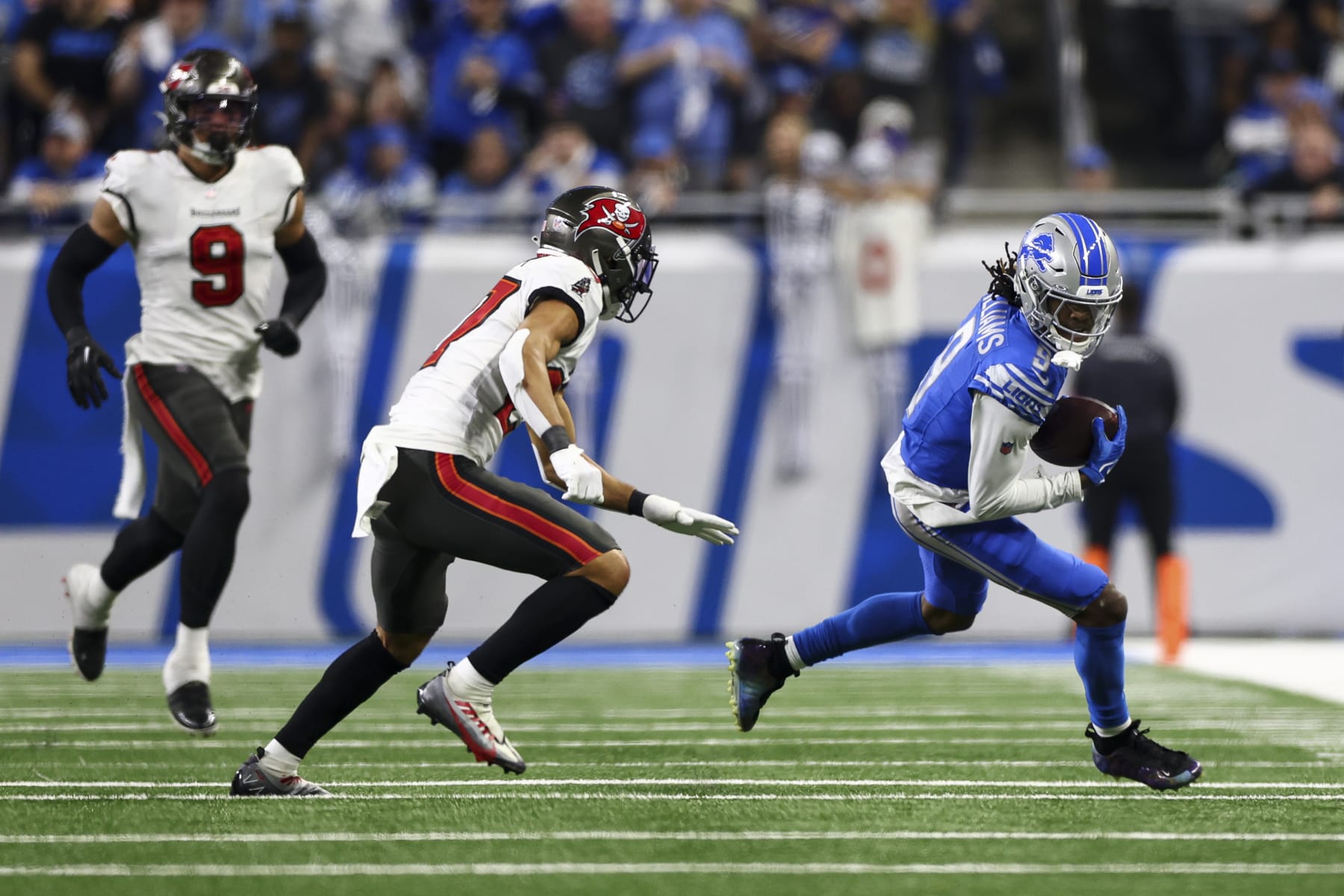 DETROIT, MI - JANUARY 21: Jameson Williams #9 of the Detroit Lions carries the ball during the fourth quarter of an NFL divisional round playoff football game against the Tampa Bay Buccaneers at Ford Field on January 21, 2024 in Detroit, Michigan. (Photo by Kevin Sabitus/Getty Images)