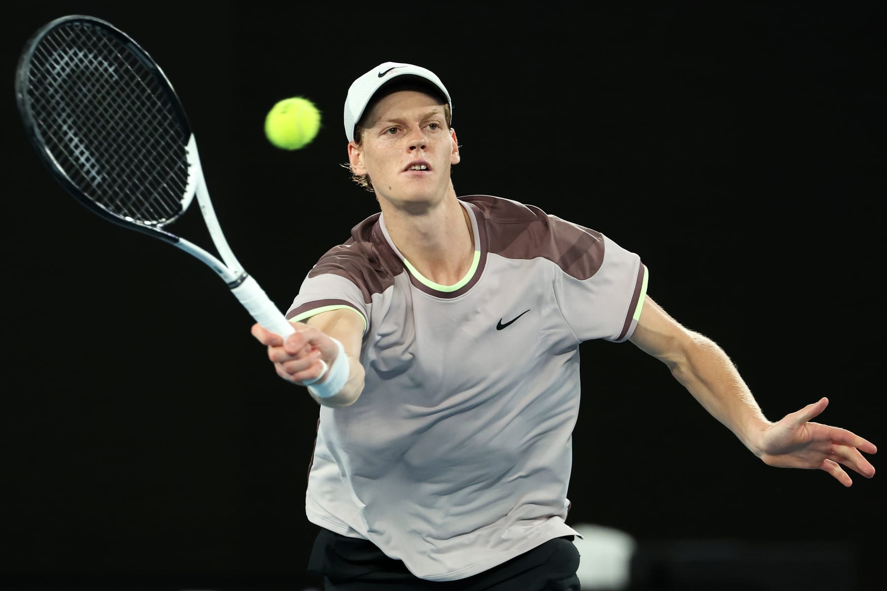 MELBOURNE, AUSTRALIA - JANUARY 28: Jannik Sinner of Italy plays a forehand during their Men's Singles Final match against Daniil Medvedev during the 2024 Australian Open at Melbourne Park on January 28, 2024 in Melbourne, Australia. (Photo by Cameron Spencer/Getty Images)