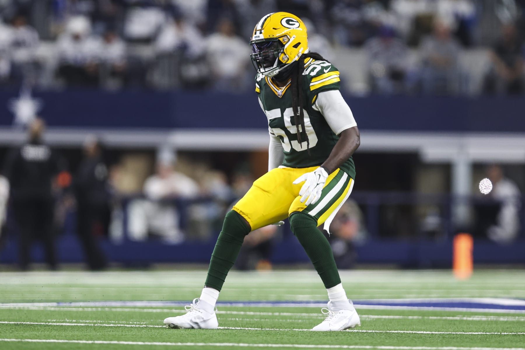 ARLINGTON, TX - JANUARY 14: De'Vondre Campbell #59 of the Green Bay Packers defends in coverage during an NFL wild-card playoff football game against the Dallas Cowboys at AT&T Stadium on January 14, 2024 in Arlington, Texas. (Photo by Perry Knotts/Getty Images)