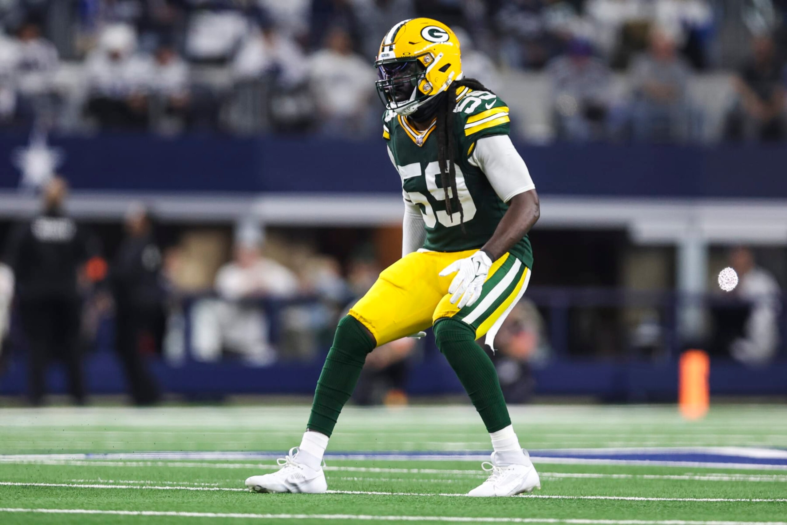 ARLINGTON, TX - JANUARY 14: De'Vondre Campbell #59 of the Green Bay Packers defends in coverage during an NFL wild-card playoff football game against the Dallas Cowboys at AT&T Stadium on January 14, 2024 in Arlington, Texas. (Photo by Perry Knotts/Getty Images)