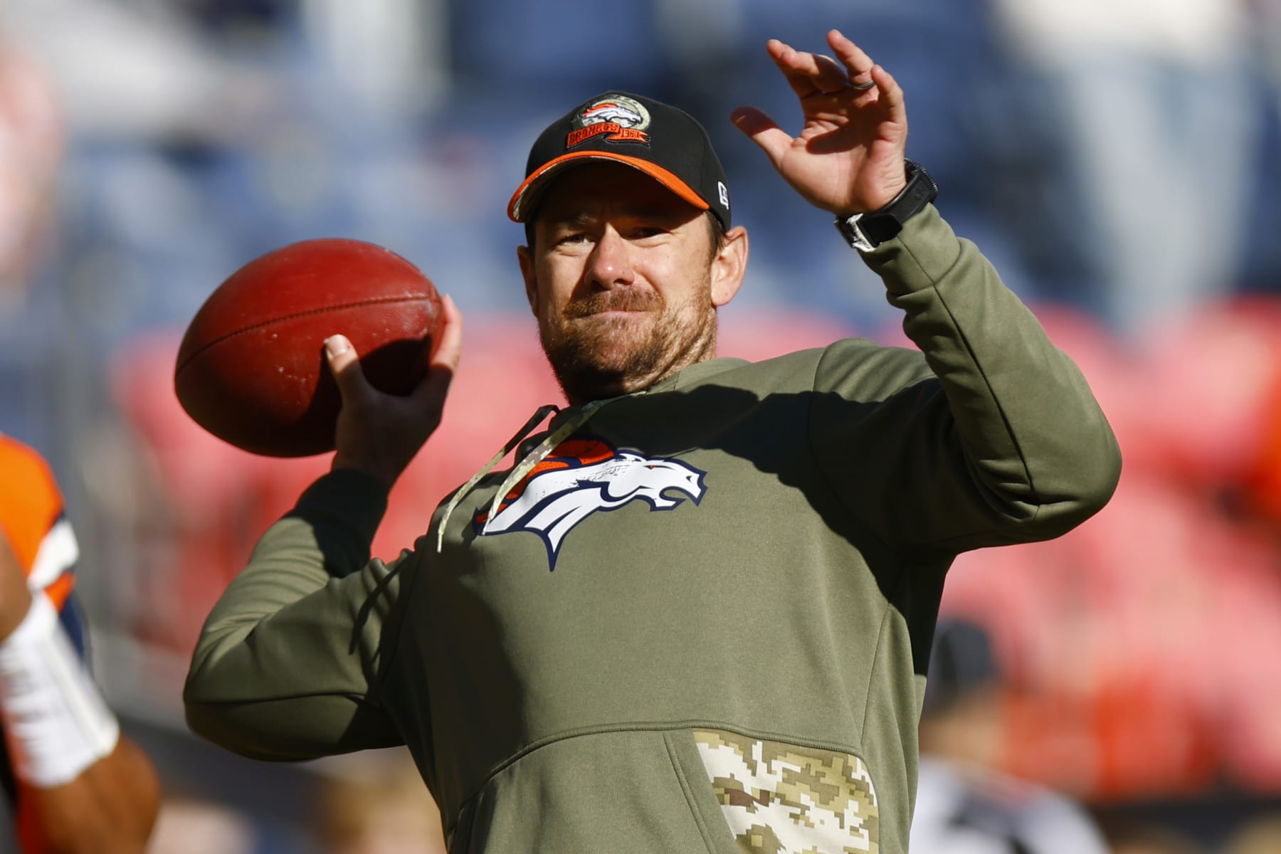 DENVER, COLORADO - NOVEMBER 20: Klint Kubiak quarterbacks coach for the Denver Broncos throws a pass during warmups prior to a game against the Las Vegas Raiders at Empower Field At Mile High on November 20, 2022 in Denver, Colorado. (Photo by Justin Edmonds/Getty Images)