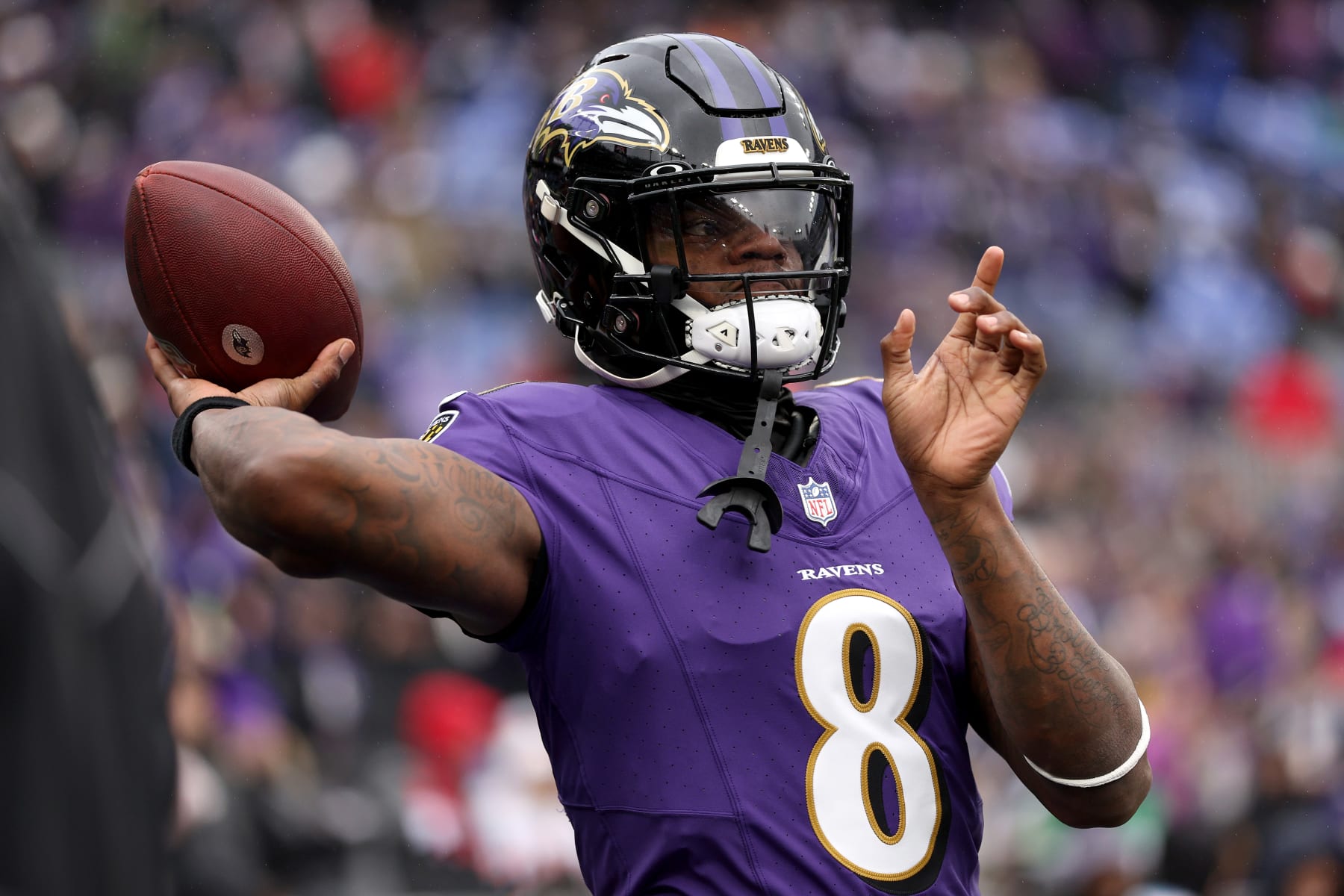 BALTIMORE, MARYLAND - JANUARY 28: Lamar Jackson #8 of the Baltimore Ravens warms up prior to the AFC Championship Game against the Kansas City Chiefs at M&T Bank Stadium on January 28, 2024 in Baltimore, Maryland. (Photo by Patrick Smith/Getty Images)