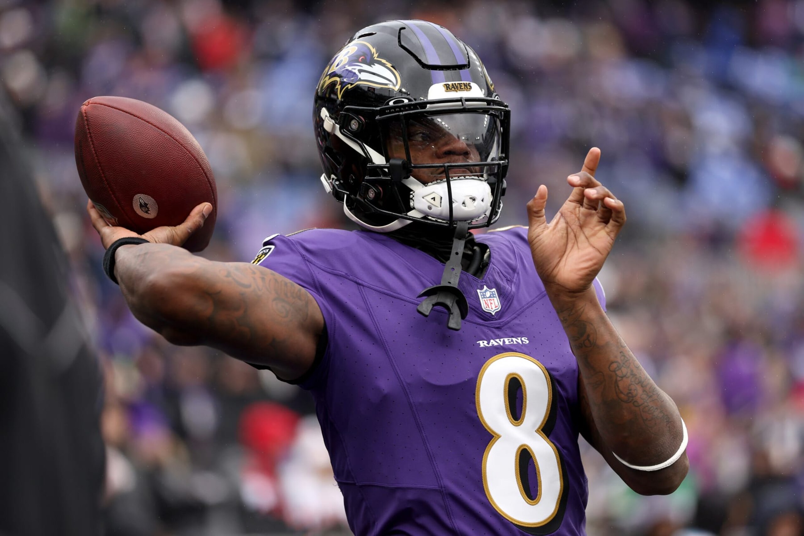 BALTIMORE, MARYLAND - JANUARY 28: Lamar Jackson #8 of the Baltimore Ravens warms up prior to the AFC Championship Game against the Kansas City Chiefs at M&T Bank Stadium on January 28, 2024 in Baltimore, Maryland. (Photo by Patrick Smith/Getty Images)