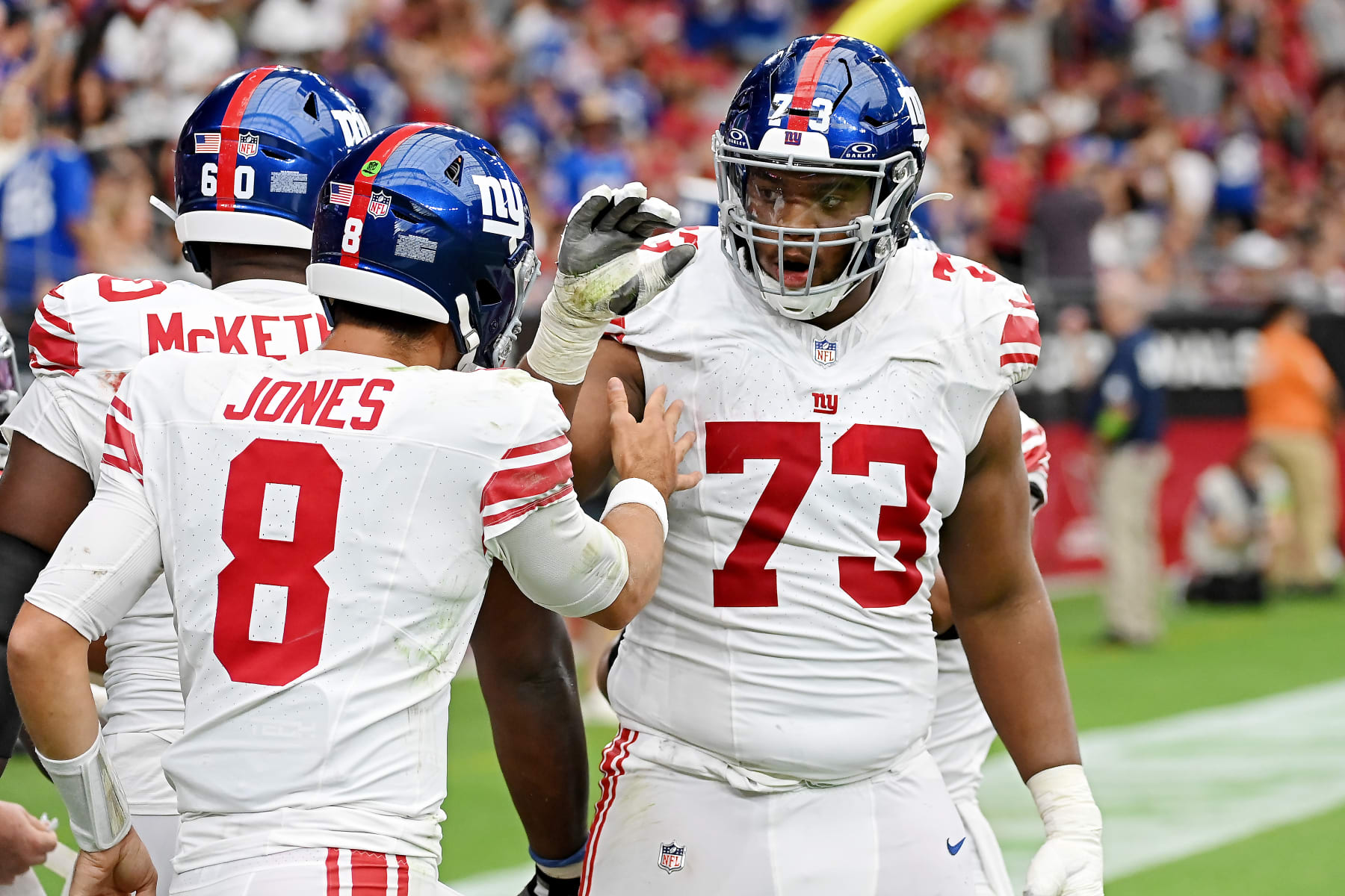 GLENDALE, ARIZONA - SEPTEMBER 17: Daniel Jones #8 of the New York Giants celebrates a play with Evan Neal #73 during the third quarter in the game against the Arizona Cardinals at State Farm Stadium on September 17, 2023 in Glendale, Arizona. (Photo by Norm Hall/Getty Images)