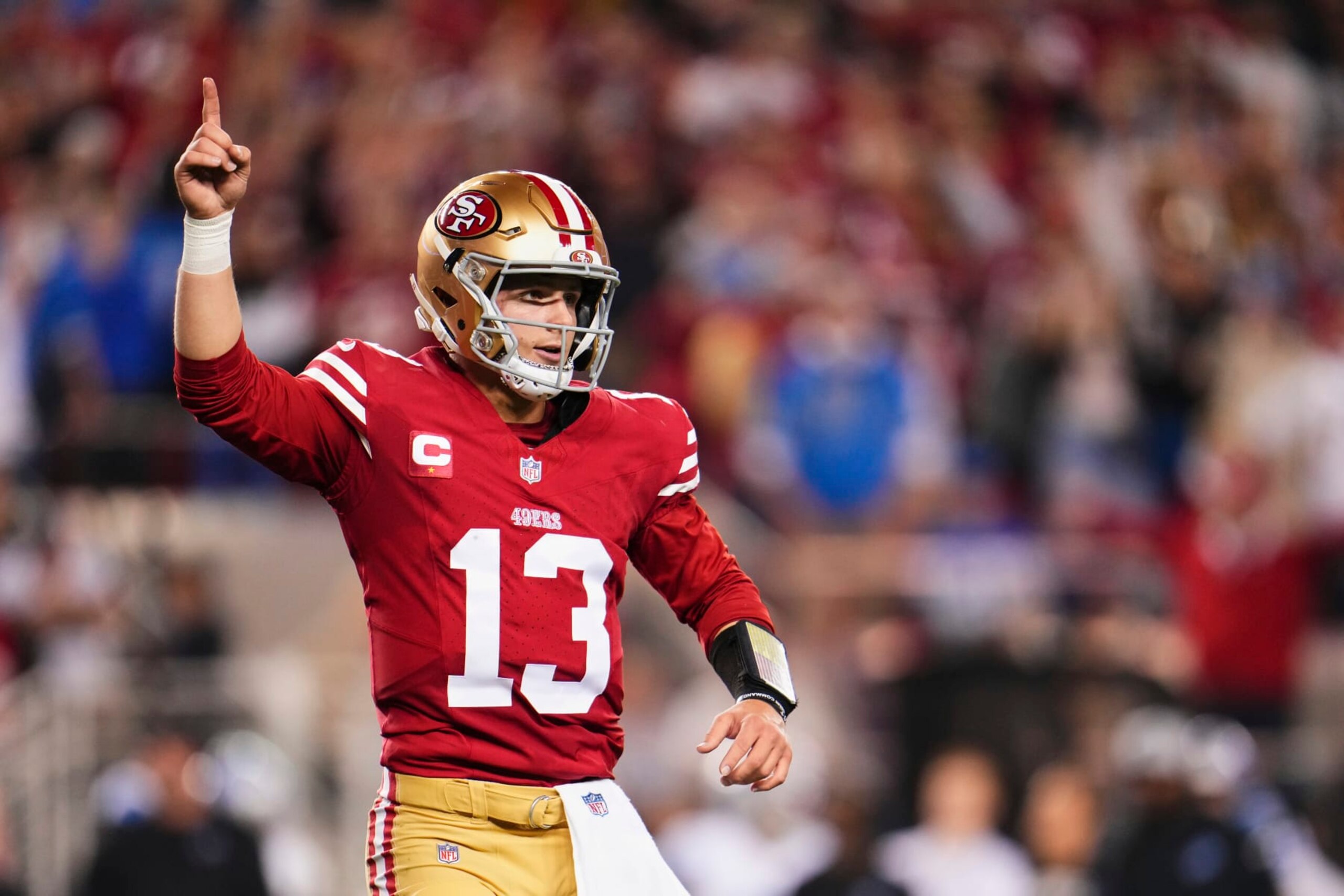 SANTA CLARA, CA - JANUARY 28: Brock Purdy #13 of the San Francisco 49ers celebrates after scoring a touchdown against the Detroit Lions during the second half of the NFC Championship football game at Levi's Stadium on January 28, 2024 in Santa Clara, California. (Photo by Cooper Neill/Getty Images)