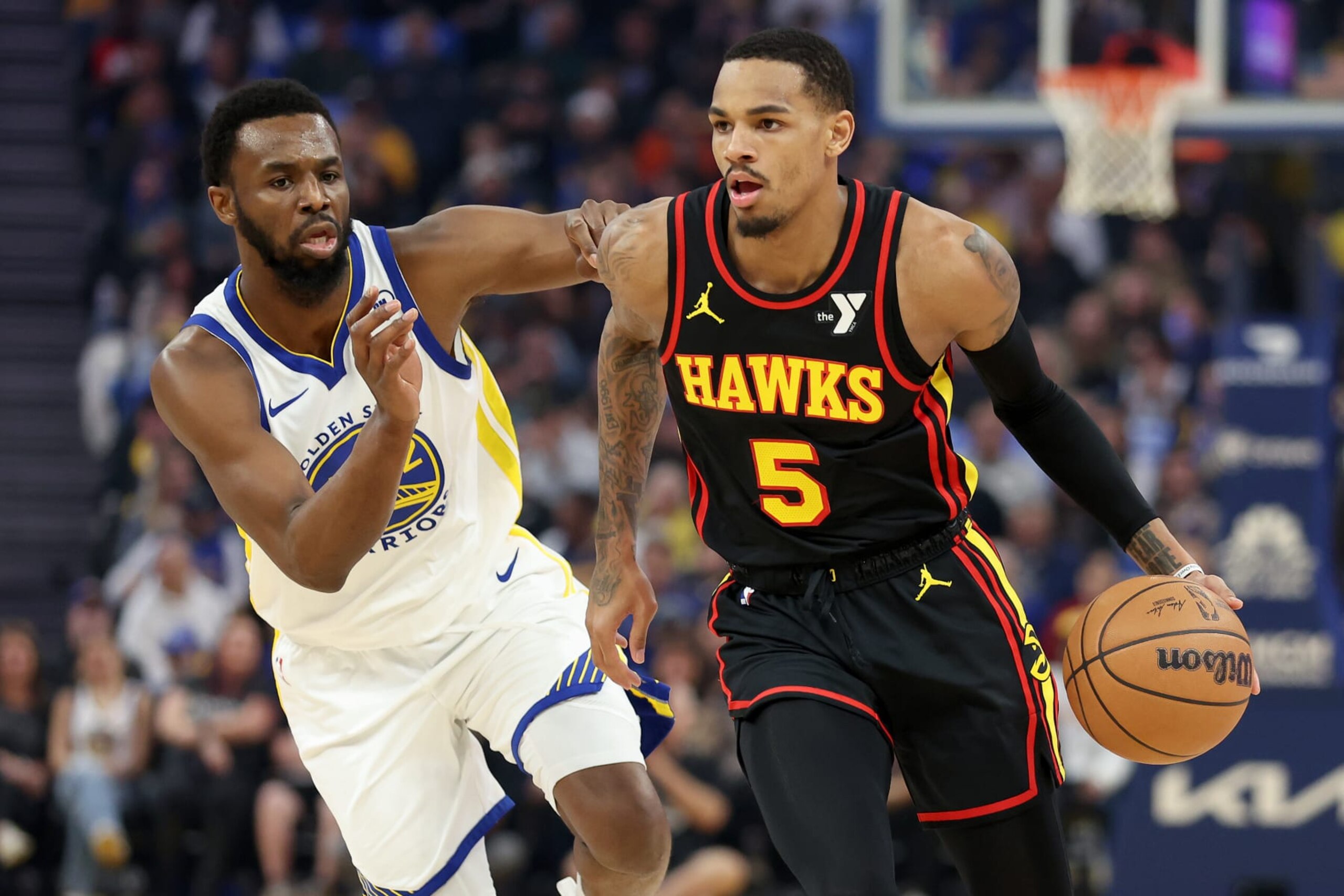 SAN FRANCISCO, CALIFORNIA - JANUARY 24: Dejounte Murray #5 of the Atlanta Hawks is guarded by Andrew Wiggins #22 of the Golden State Warriors in the first half at Chase Center on January 24, 2024 in San Francisco, California. NOTE TO USER: User expressly acknowledges and agrees that, by downloading and or using this photograph, User is consenting to the terms and conditions of the Getty Images License Agreement. (Photo by Ezra Shaw/Getty Images) SAN FRANCISCO, CALIFORNIA - JANUARY 24: Dejounte Murray #5 of the Atlanta Hawks is guarded by Andrew Wiggins #22 of the Golden State Warriors in the first half at Chase Center on January 24, 2024 in San Francisco, California. NOTE TO USER: User expressly acknowledges and agrees that, by downloading and or using this photograph, User is consenting to the terms and conditions of the Getty Images License Agreement. (Photo by Ezra Shaw/Getty Images)