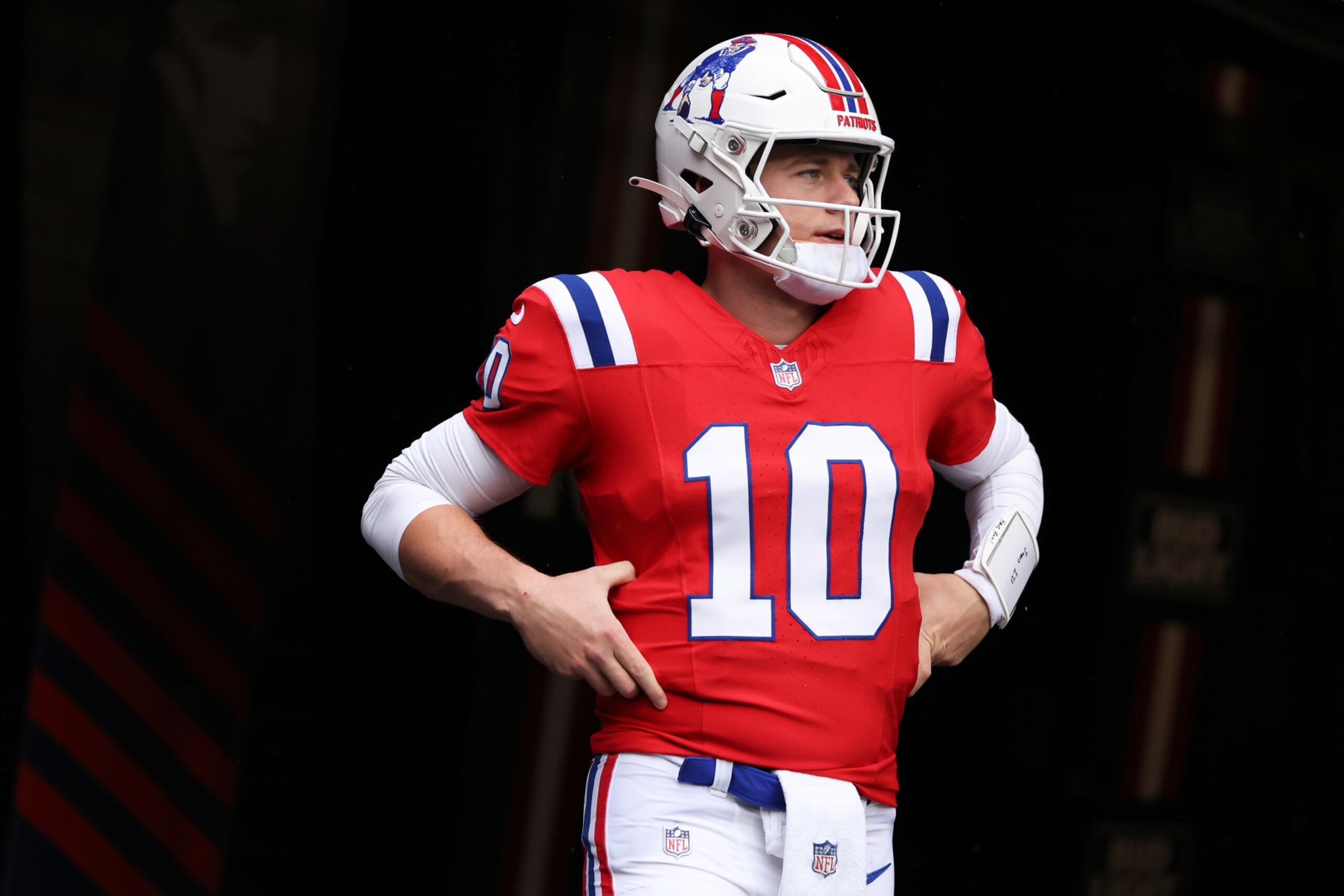 FOXBOROUGH, MASSACHUSETTS - DECEMBER 03: Mac Jones #10 of the New England Patriots walks onto the field before the game against the Los Angeles Chargers at Gillette Stadium on December 03, 2023 in Foxborough, Massachusetts. (Photo by Maddie Meyer/Getty Images)