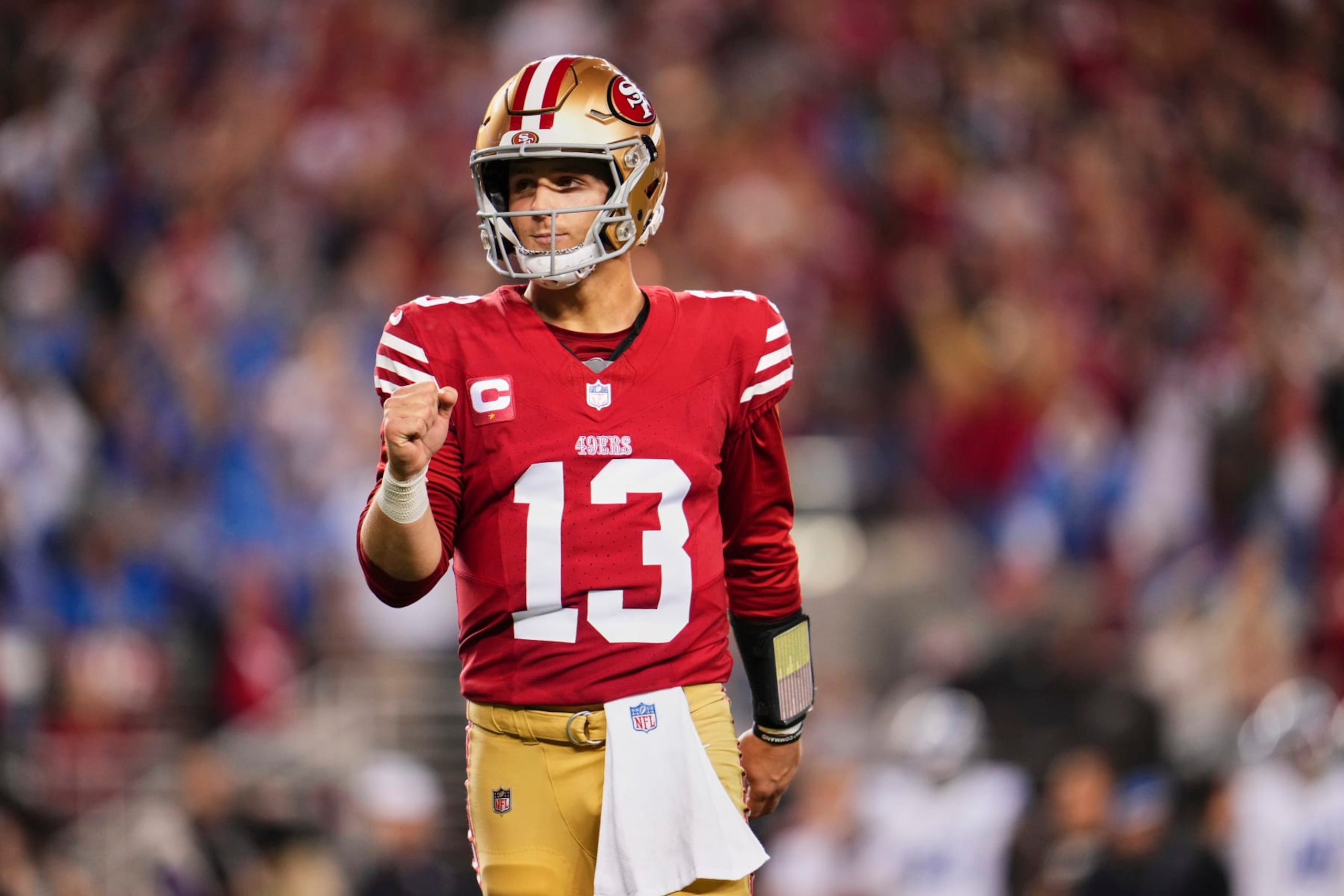 SANTA CLARA, CA - JANUARY 28: Brock Purdy #13 of the San Francisco 49ers celebrates after scoring a touchdown against the Detroit Lions during the second half of the NFC Championship football game at Levi's Stadium on January 28, 2024 in Santa Clara, California. (Photo by Cooper Neill/Getty Images)