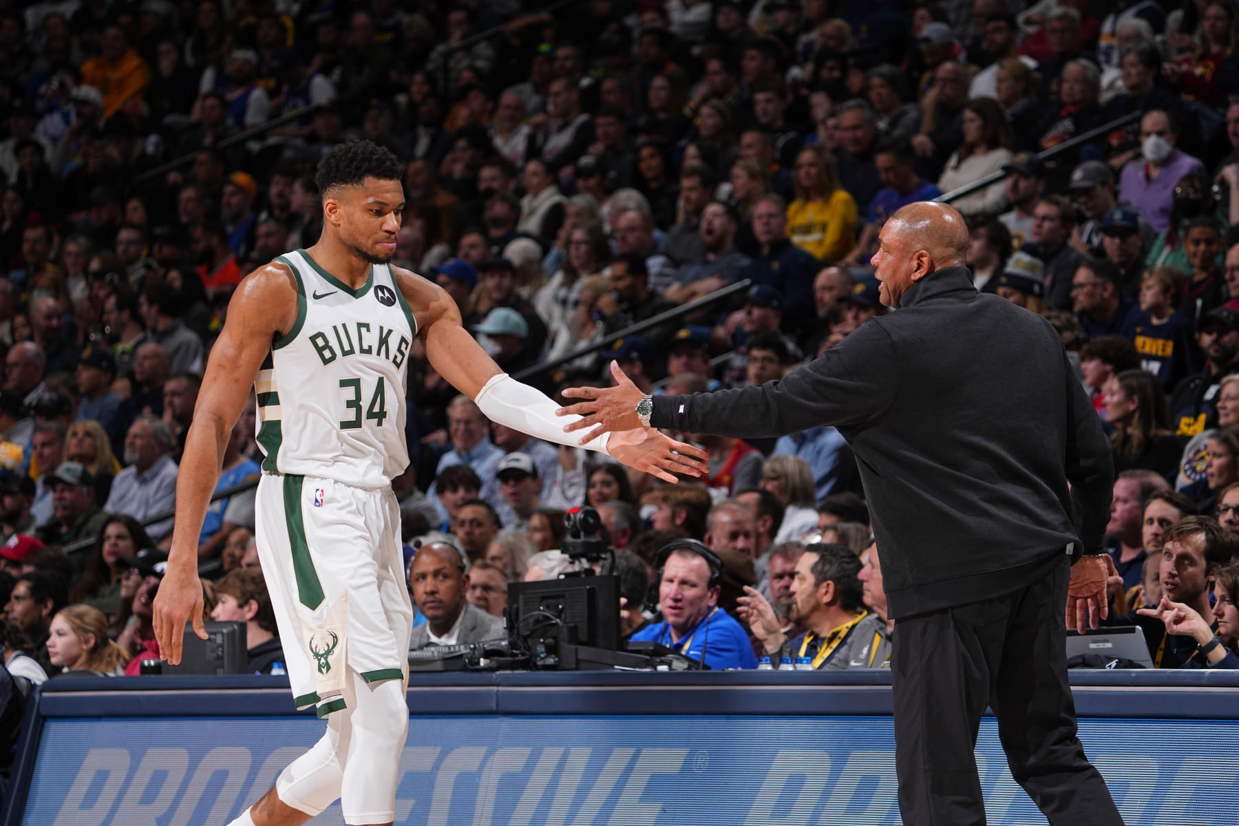 DENVER, CO - JANUARY 29: Giannis Antetokounmpo #34 high fives Head Coach Doc Rivers of the Milwaukee Bucks during the game against the Denver Nuggets on January 29, 2024 at the Ball Arena in Denver, Colorado. NOTE TO USER: User expressly acknowledges and agrees that, by downloading and/or using this Photograph, user is consenting to the terms and conditions of the Getty Images License Agreement. Mandatory Copyright Notice: Copyright 2024 NBAE (Photo by Bart Young/NBAE via Getty Images)
