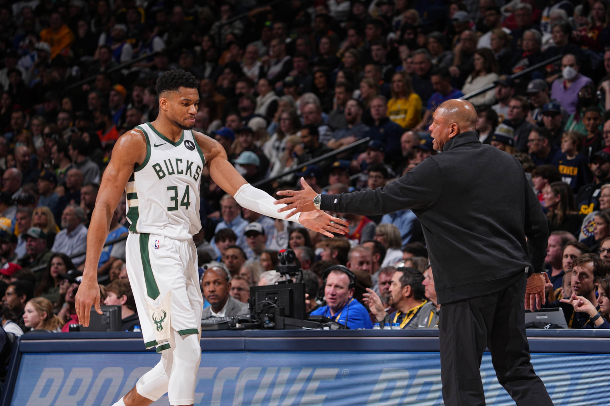 DENVER, CO - JANUARY 29: Giannis Antetokounmpo #34 high fives Head Coach Doc Rivers of the Milwaukee Bucks during the game against the Denver Nuggets on January 29, 2024 at the Ball Arena in Denver, Colorado. NOTE TO USER: User expressly acknowledges and agrees that, by downloading and/or using this Photograph, user is consenting to the terms and conditions of the Getty Images License Agreement. Mandatory Copyright Notice: Copyright 2024 NBAE (Photo by Bart Young/NBAE via Getty Images)