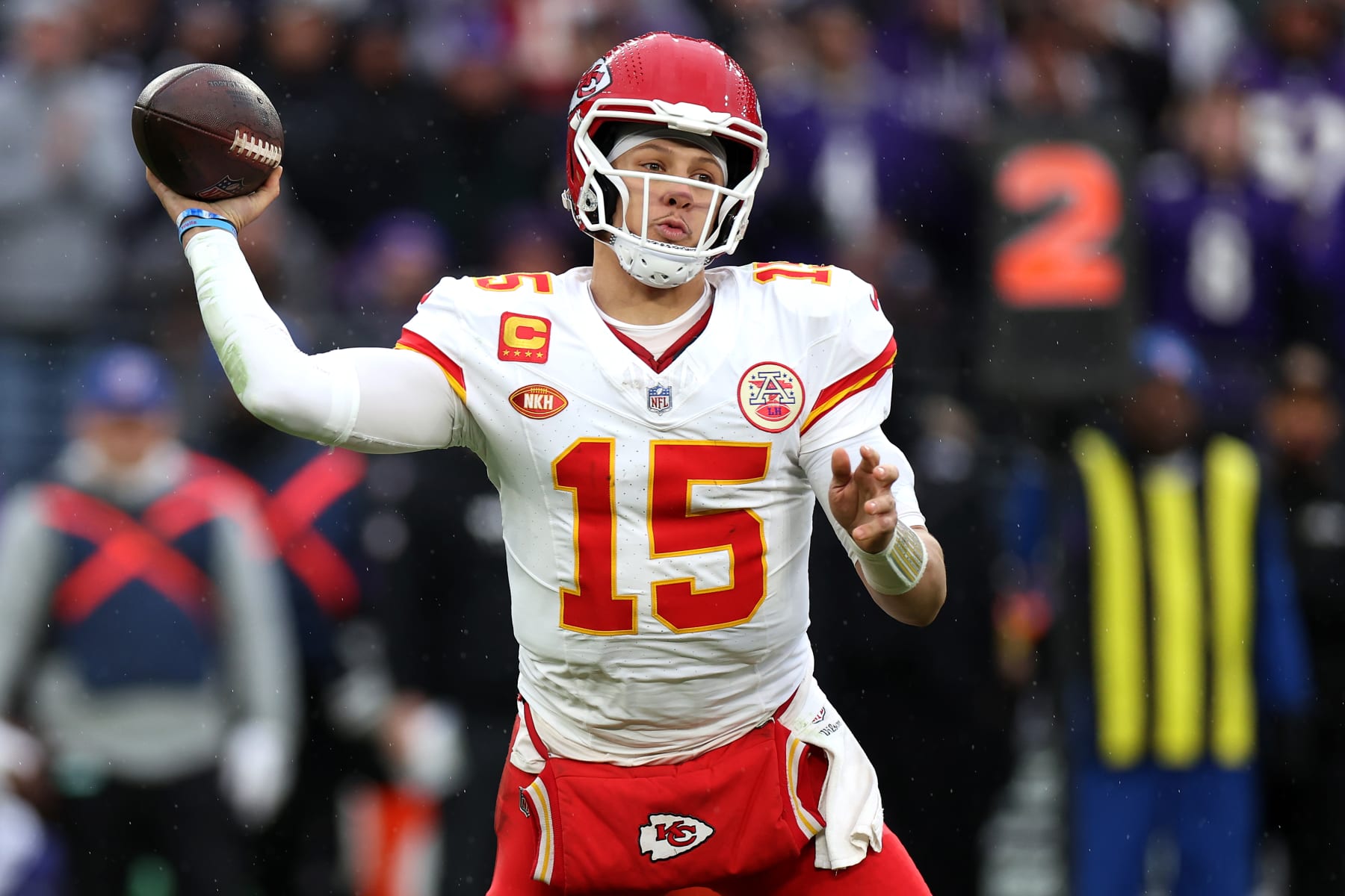 BALTIMORE, MARYLAND - JANUARY 28: Patrick Mahomes #15 of the Kansas City Chiefs rolls out to pass against the Baltimore Ravens in the AFC Championship Game  at M&T Bank Stadium on January 28, 2024 in Baltimore, Maryland. (Photo by Rob Carr/Getty Images)