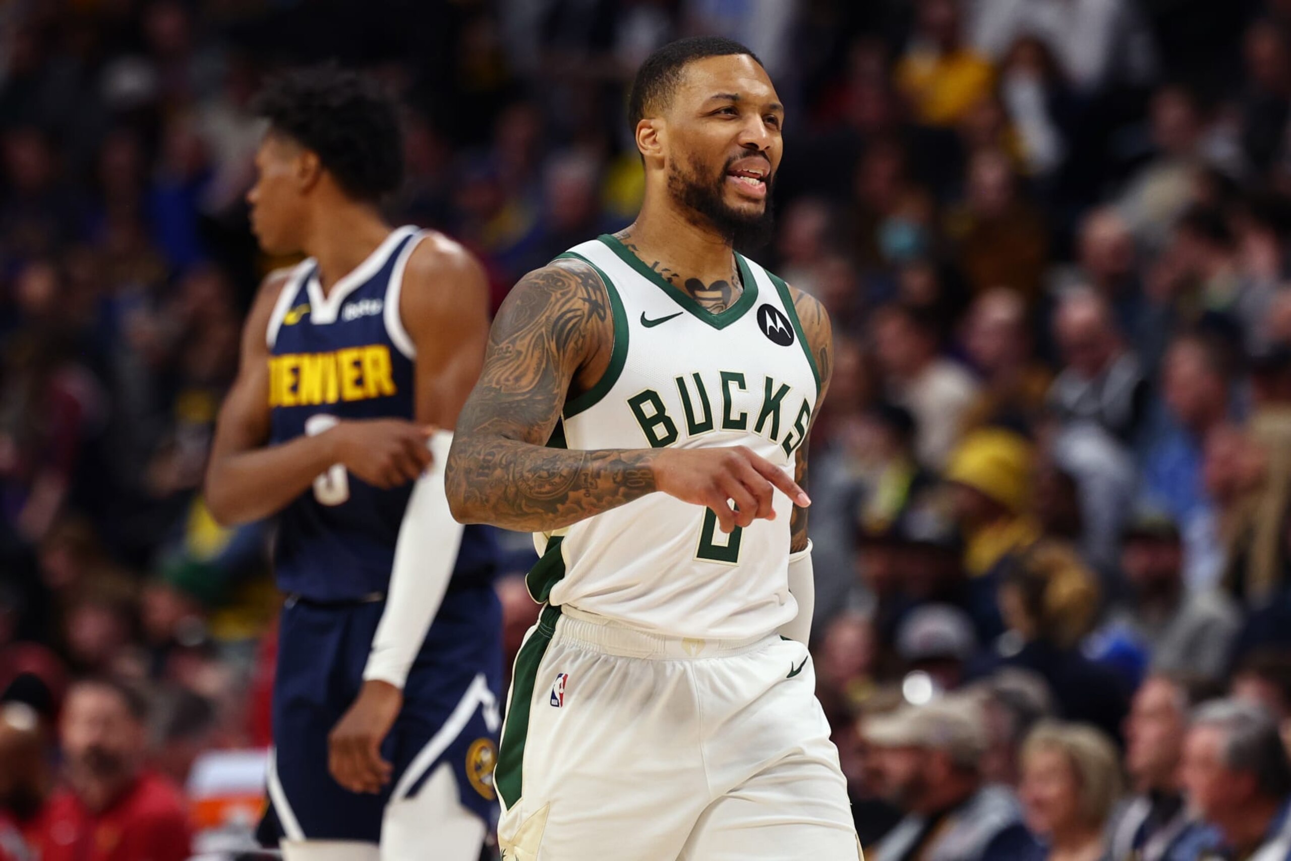 DENVER, COLORADO - JANUARY 29: Damian Lillard #0 of the Milwaukee Bucks reacts to a play against the Denver Nuggets at Ball Arena on January 29, 2024 in Denver, Colorado. NOTE TO USER: User expressly acknowledges and agrees that, by downloading and/or using this Photograph, user is consenting to the terms and conditions of the Getty Images License Agreement. (Photo by Alysa Rubin/Clarkson Creative/Getty Images)