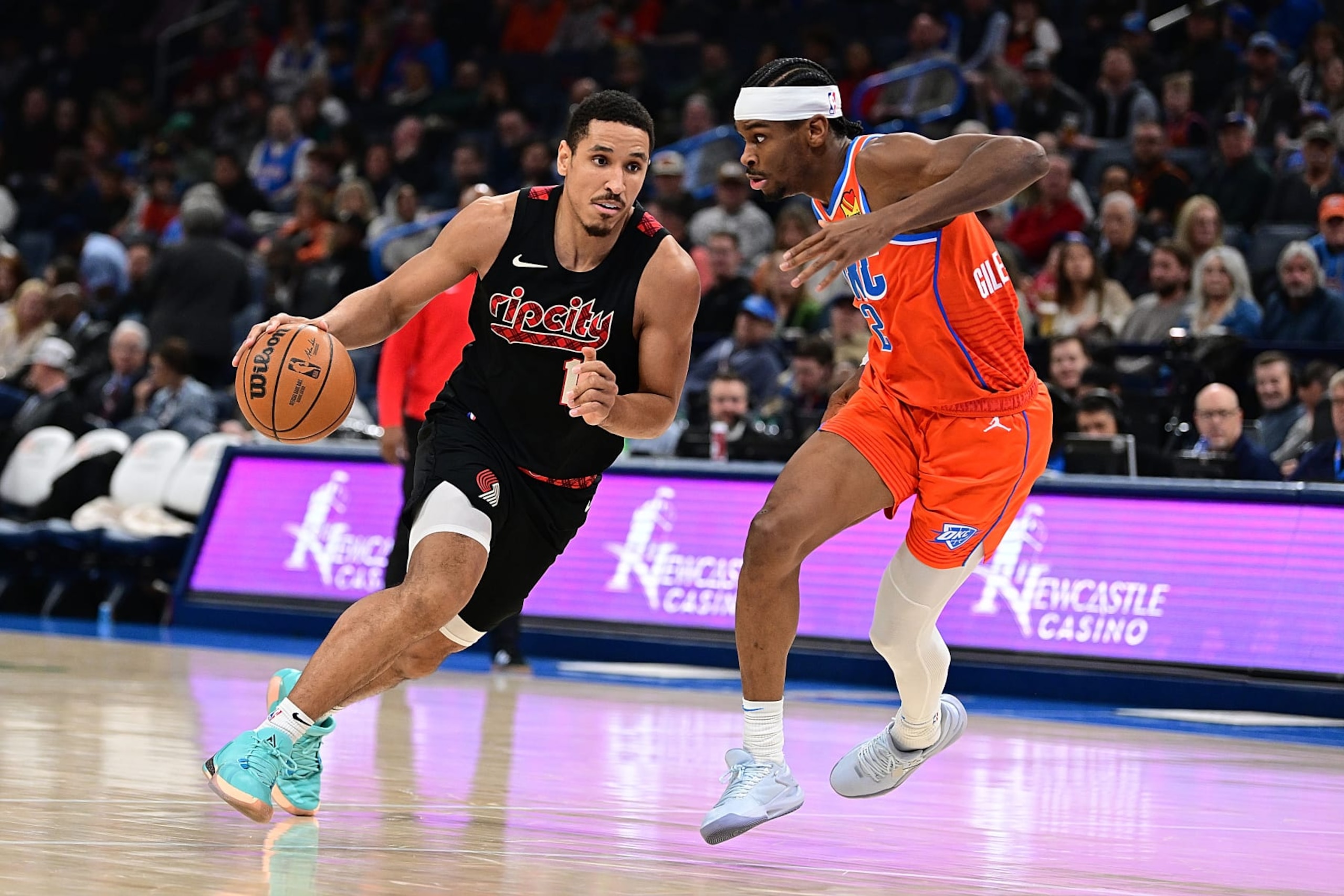 OKLAHOMA CITY, OKLAHOMA - JANUARY 23: Malcolm Brogdon #11 of the Portland Trail Blazers handles the ball during the second half against Shai Gilgeous-Alexander #2 of the Oklahoma City Thunder at Paycom Center on January 23, 2024 in Oklahoma City, Oklahoma. NOTE TO USER: User expressly acknowledges and agrees that, by downloading and or using this Photograph, user is consenting to the terms and conditions of the Getty Images License Agreement. (Photo by Joshua Gateley/Getty Images) OKLAHOMA CITY, OKLAHOMA - JANUARY 23: Malcolm Brogdon #11 of the Portland Trail Blazers handles the ball during the second half against Shai Gilgeous-Alexander #2 of the Oklahoma City Thunder at Paycom Center on January 23, 2024 in Oklahoma City, Oklahoma. NOTE TO USER: User expressly acknowledges and agrees that, by downloading and or using this Photograph, user is consenting to the terms and conditions of the Getty Images License Agreement. (Photo by Joshua Gateley/Getty Images)